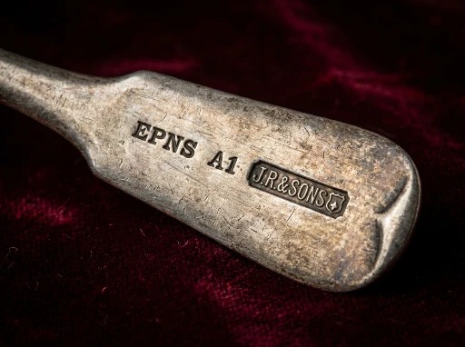 EPNS electroplate marks stamped in a row on the base of a silver-plated piece