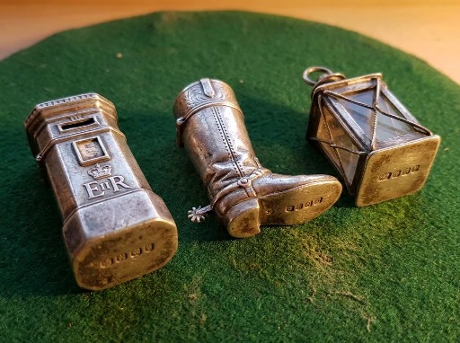 A novelty figural antique silver vesta case modelled in a distinctive shape