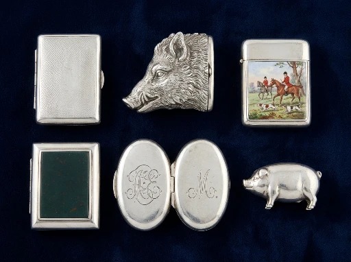 A group of antique silver vesta match cases, including engine-turned and novelty forms