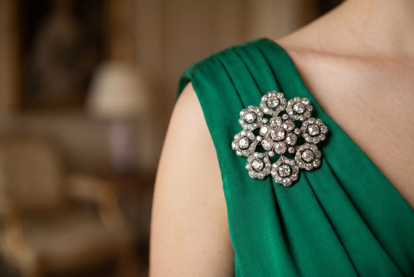 A statement antique diamond brooch on an evening gown — the red-carpet trend behind the 2026 brooch revival