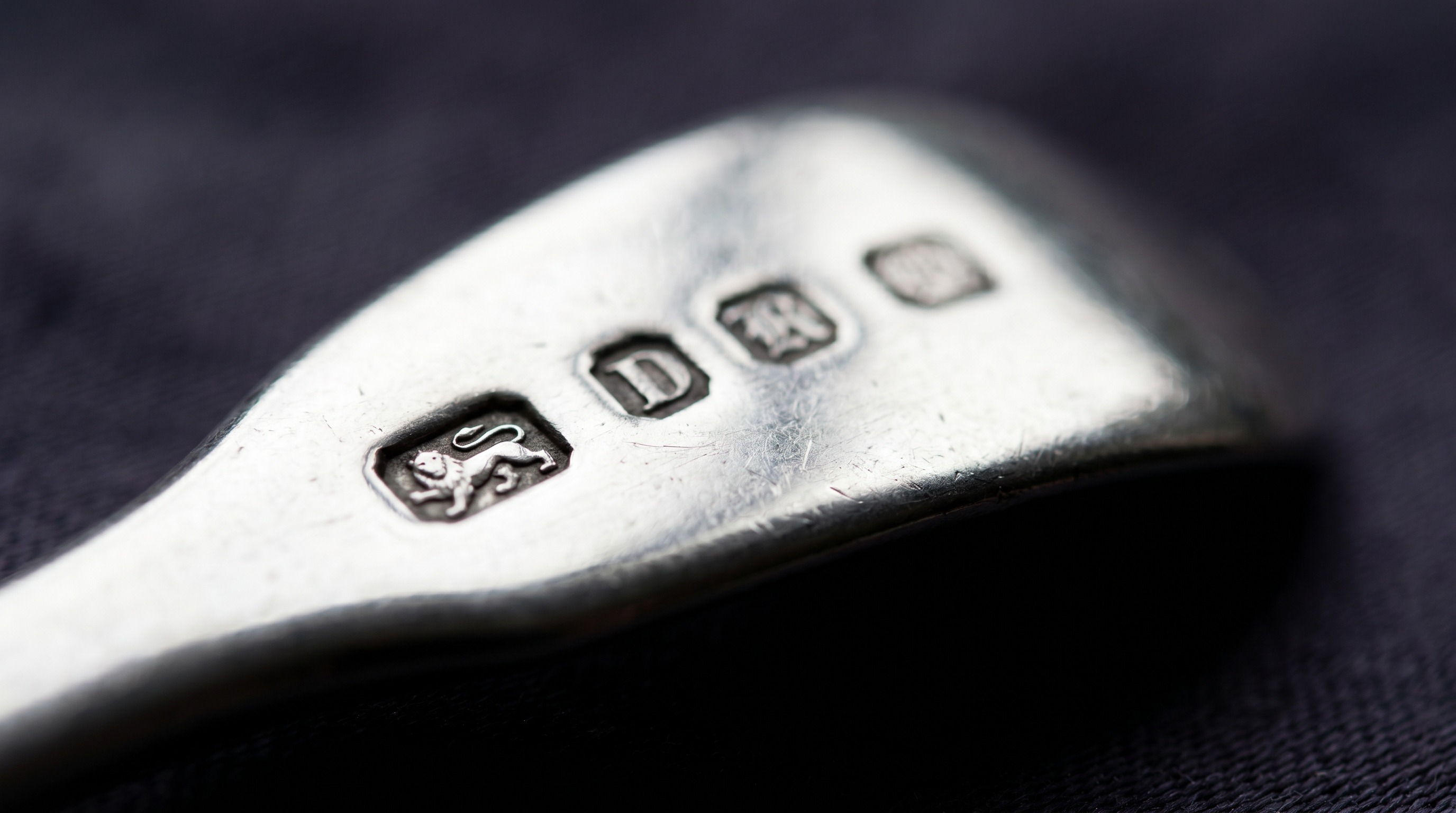 British silver hallmarks on the handle of an antique caddy spoon