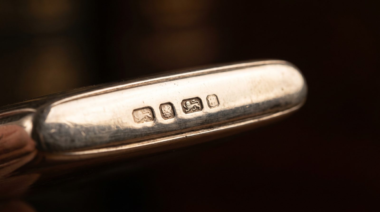 British silver hallmarks on the edge of an antique card case