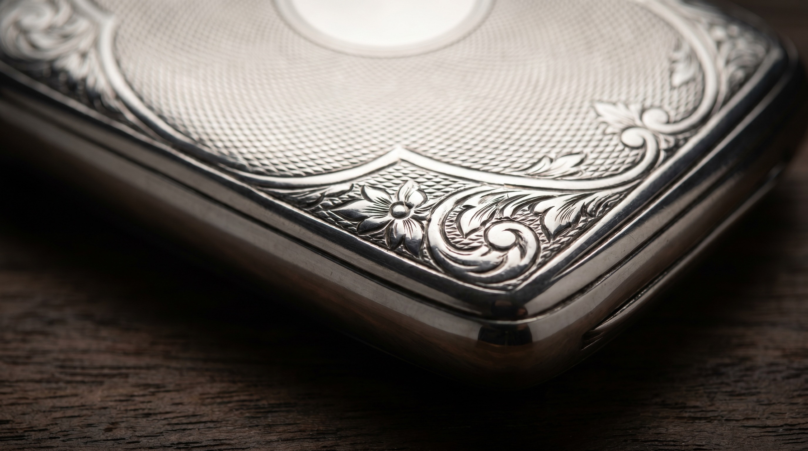 Engine-turned surface of an antique silver cigar case