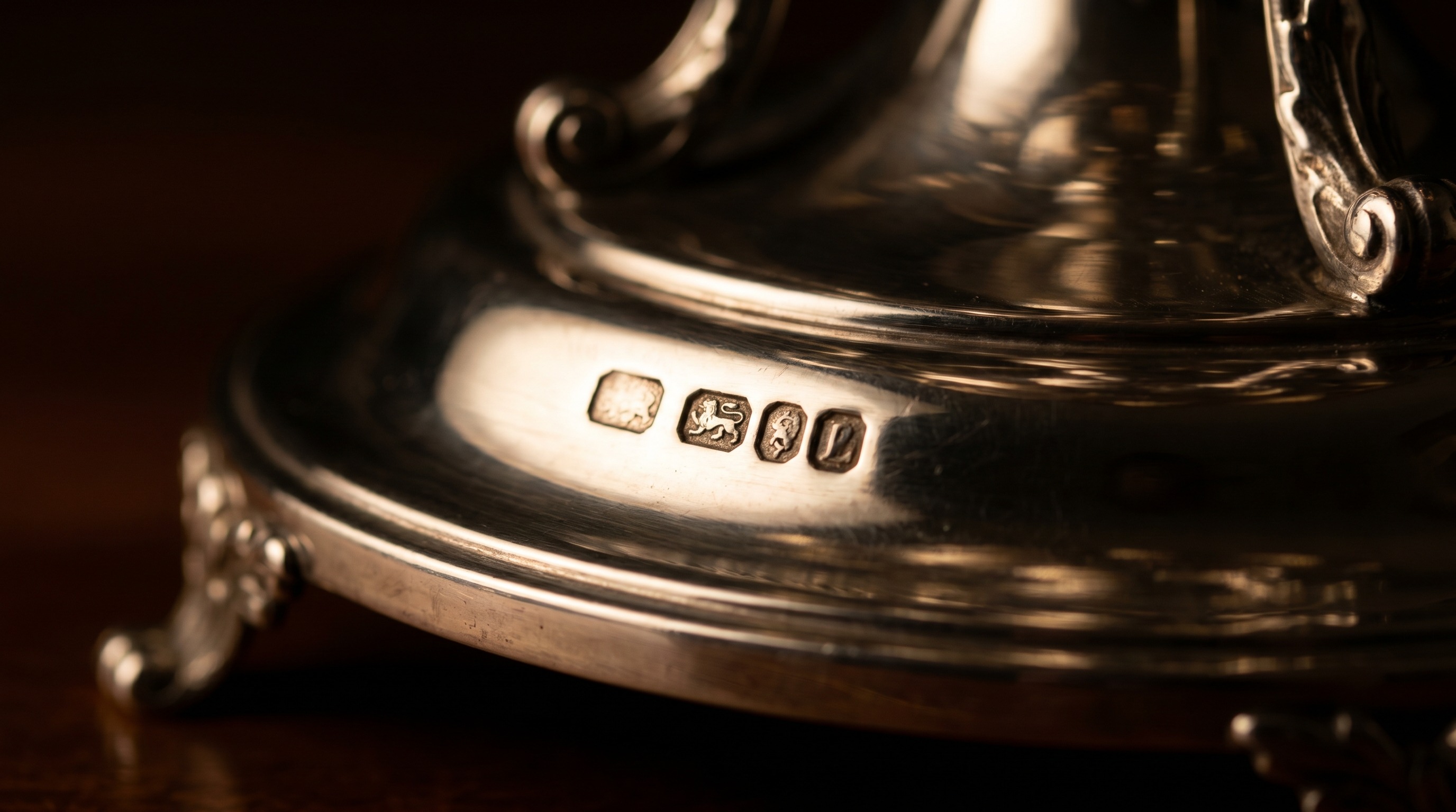 British silver hallmarks on the base of an antique epergne