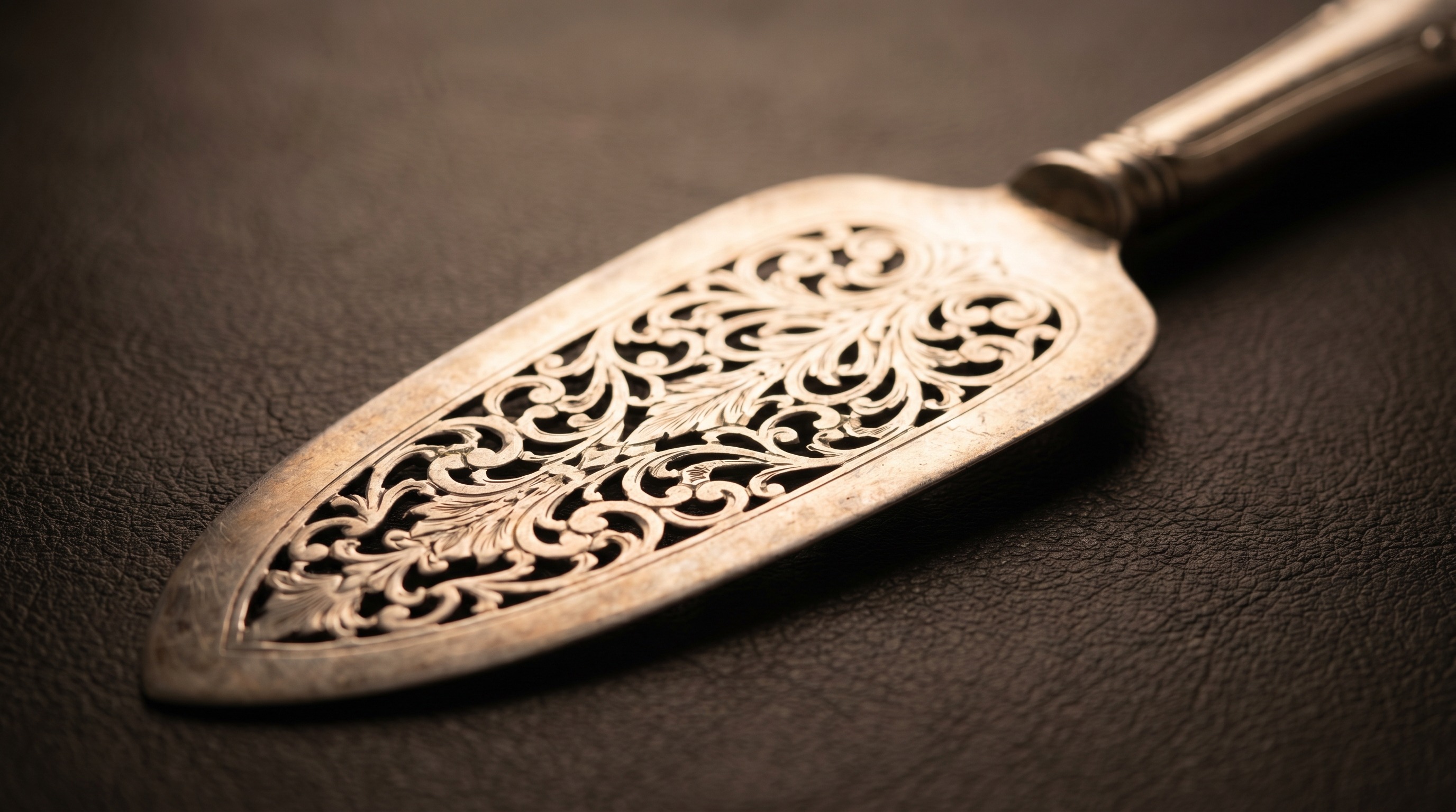 Pierced and engraved blade of an antique silver fish slice