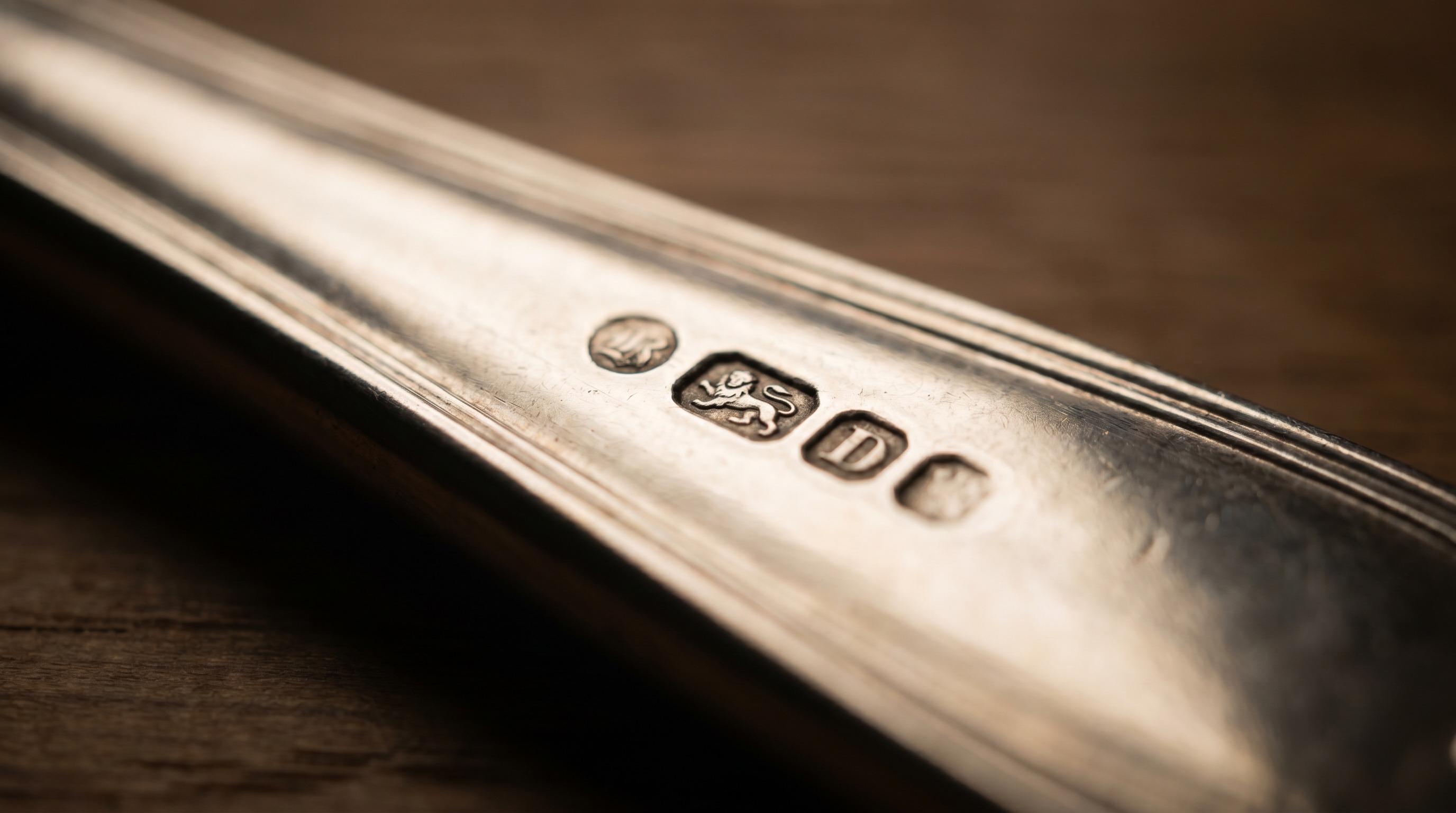 British silver hallmarks on the handle of an antique fish slice