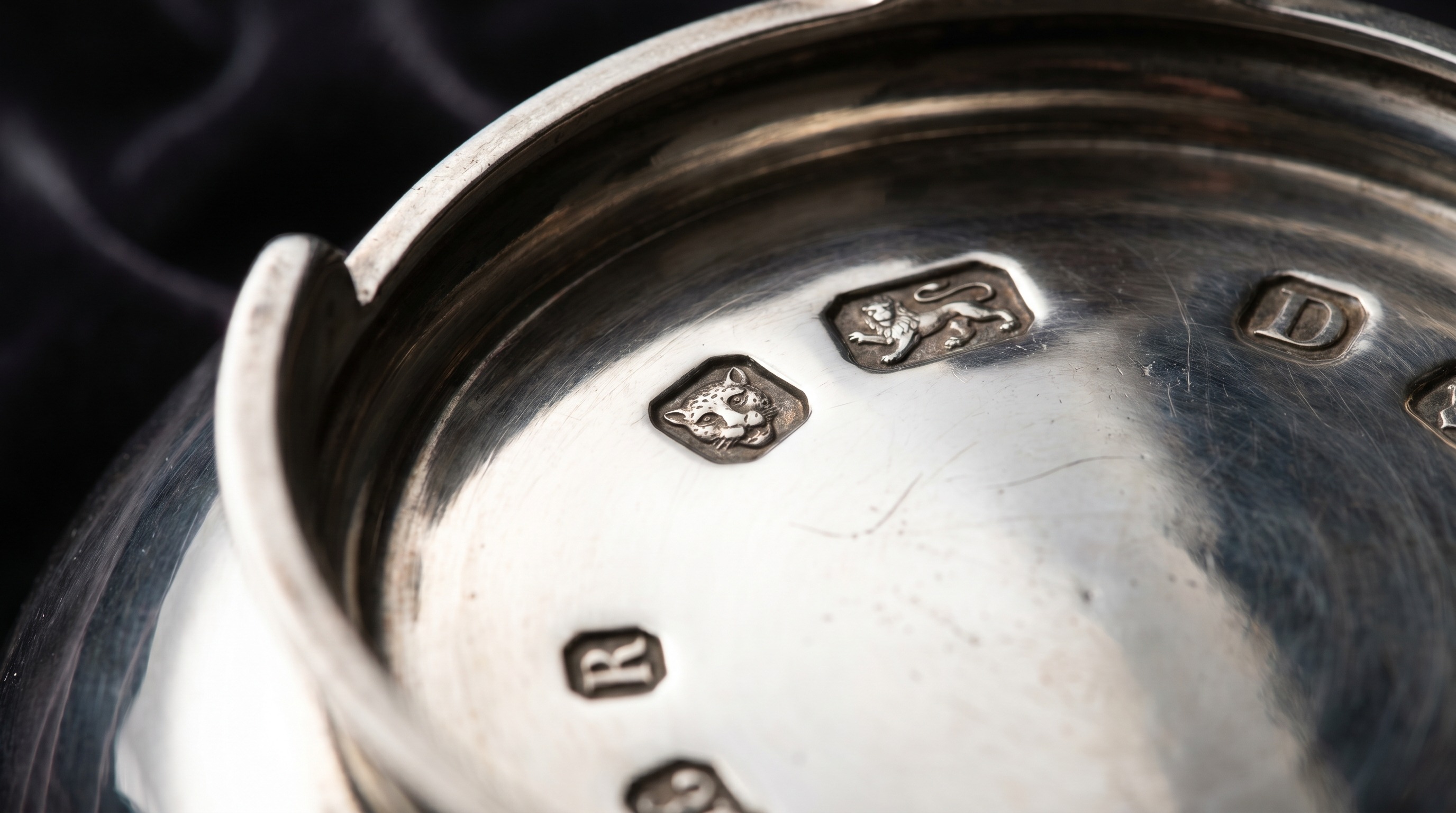 British silver hallmarks on the base of an antique punch bowl