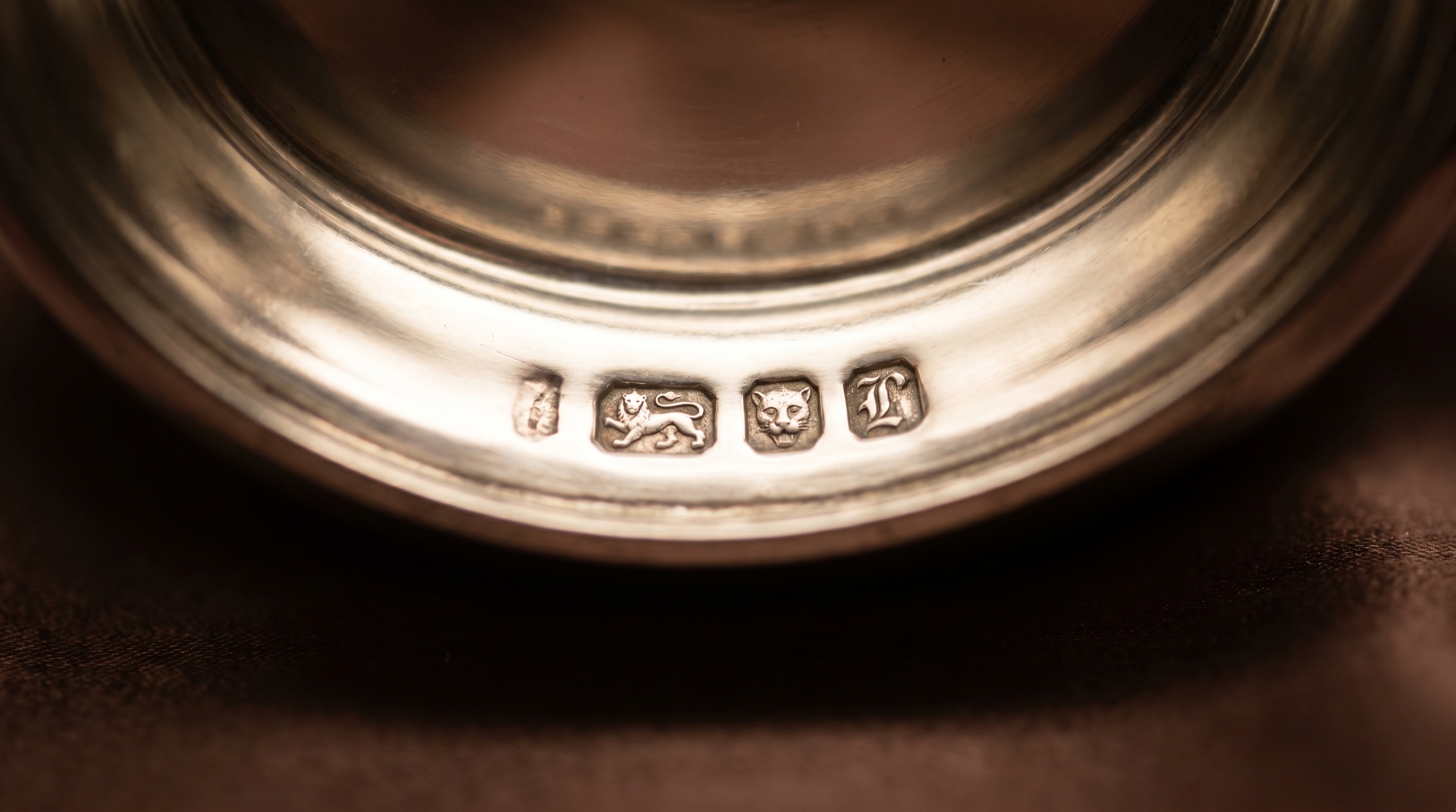 British silver hallmarks on the base of an antique salt cellar