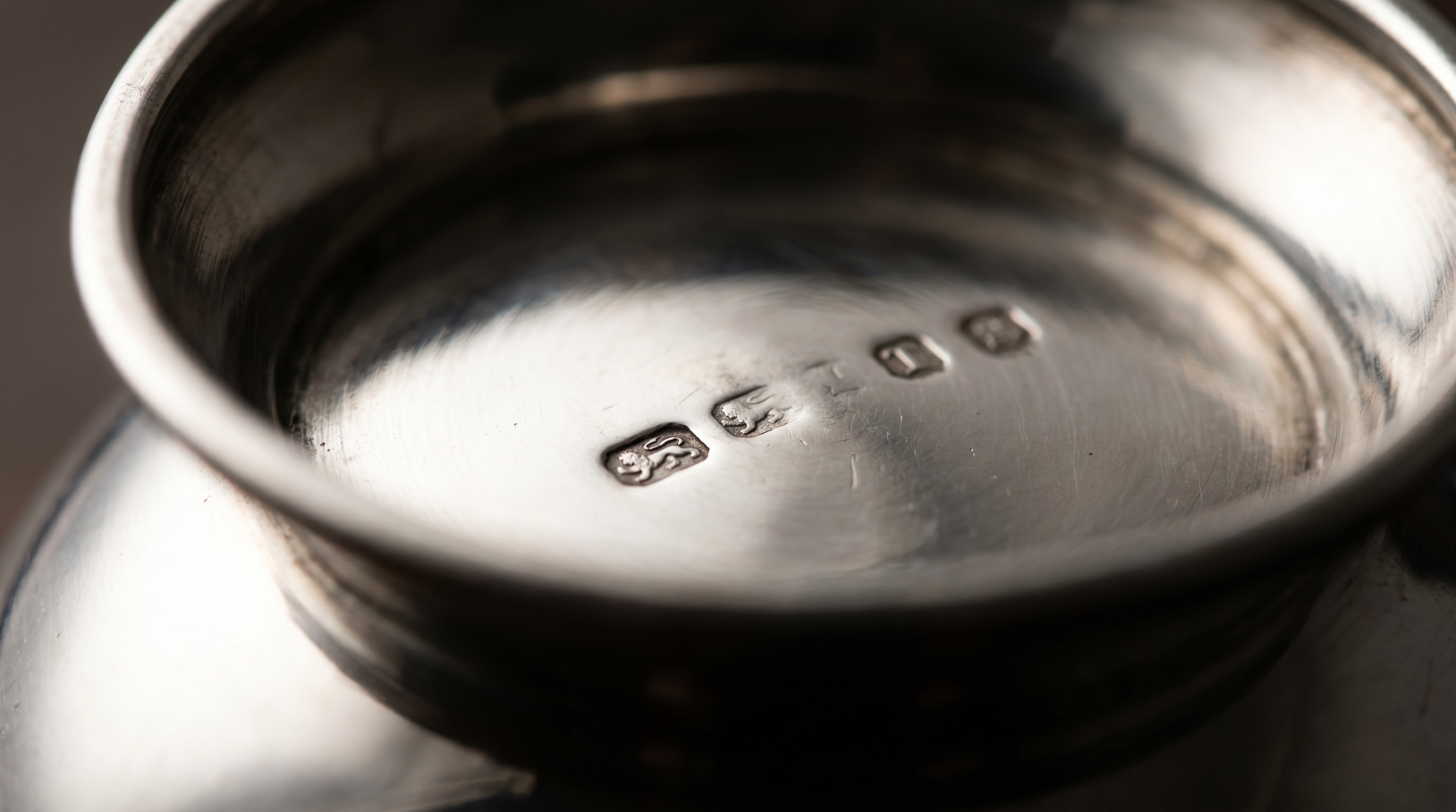 British silver hallmarks on the underside of an antique sauce boat