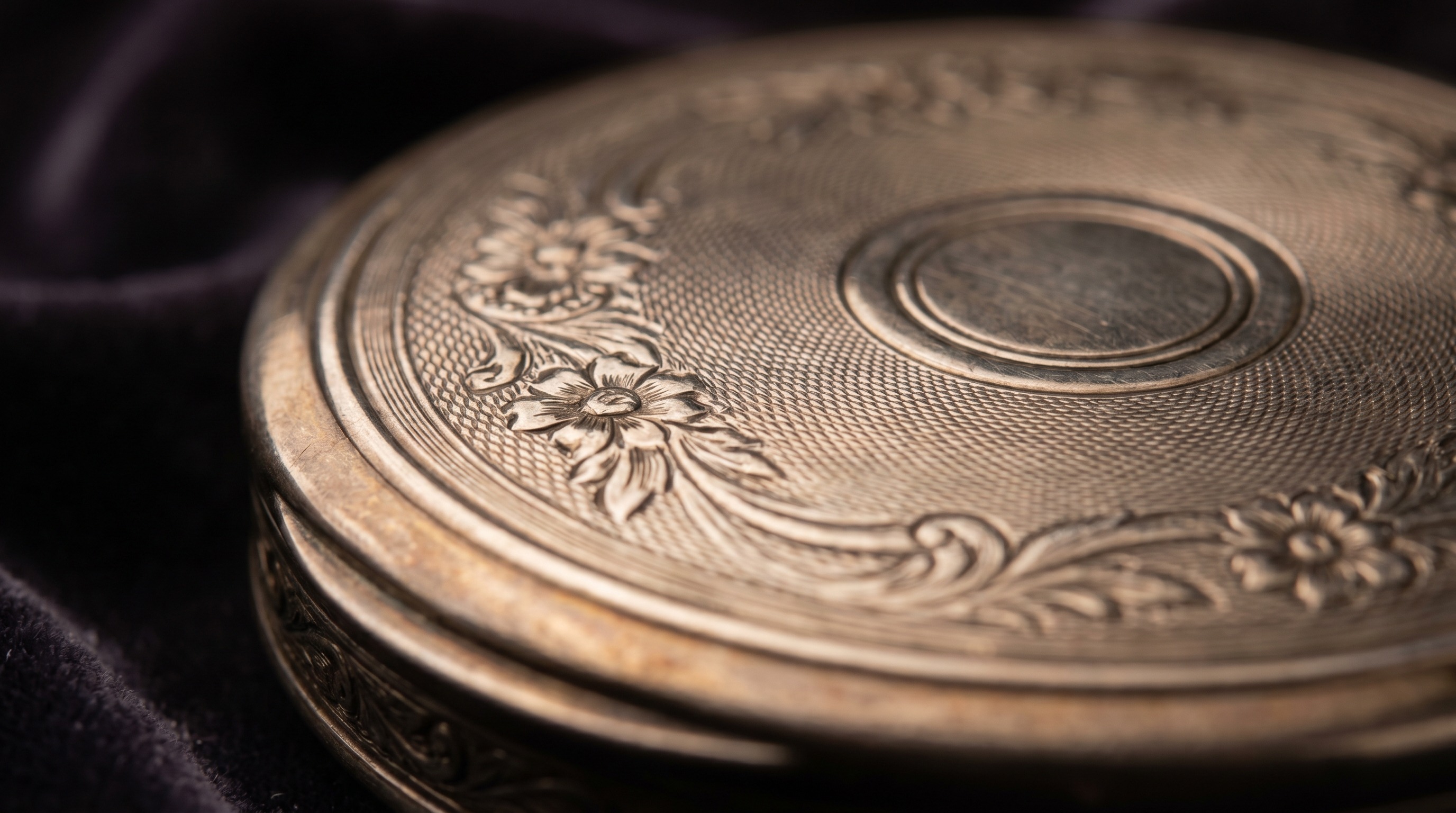 Engine-turned lid of an antique silver snuff box