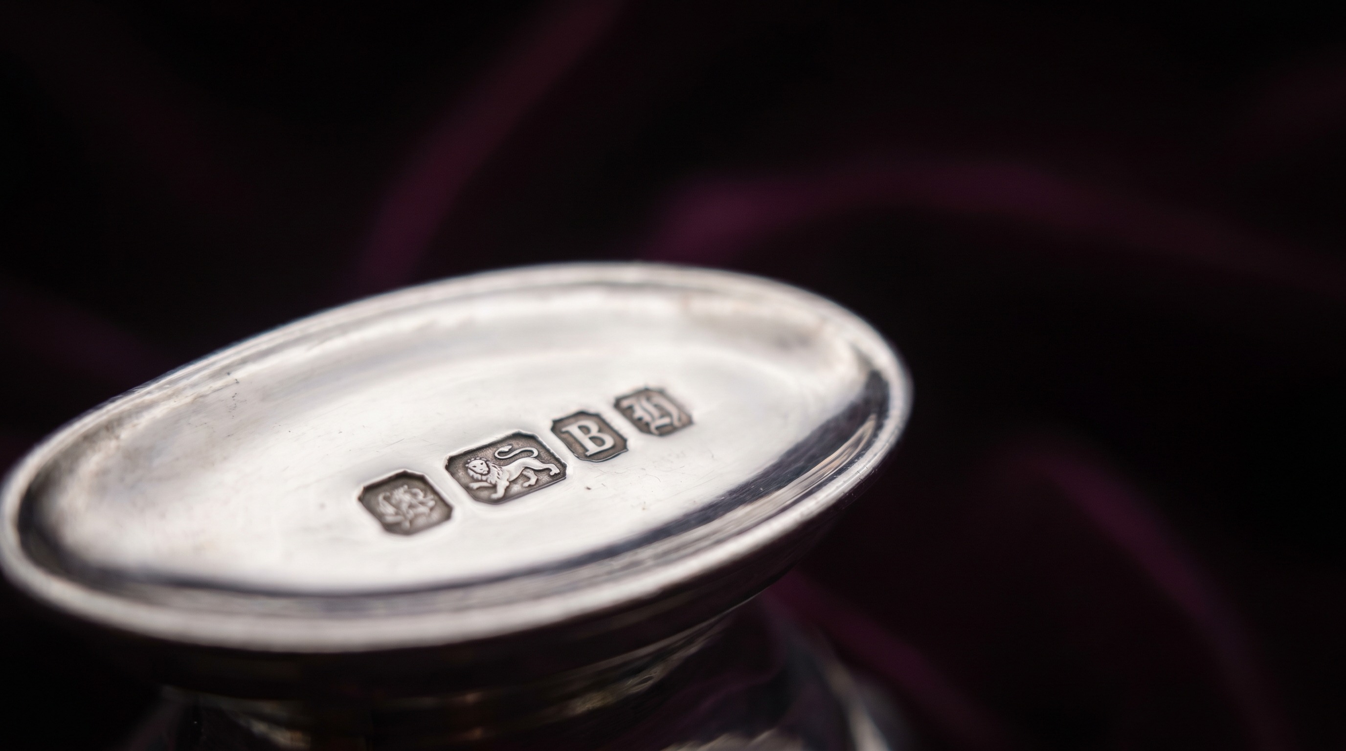 British silver hallmarks on the base of an antique sugar caster