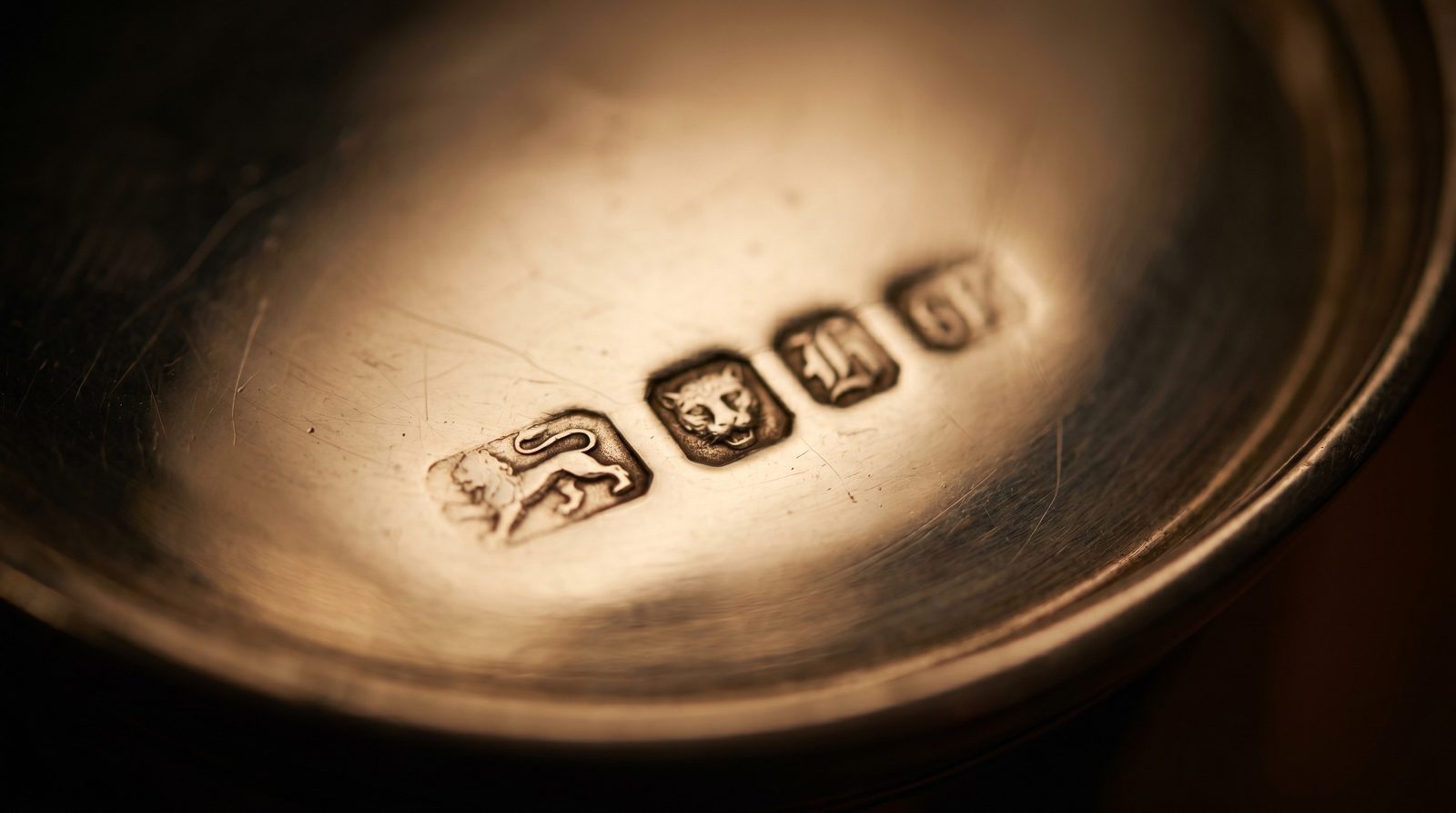 British silver hallmarks on the base of an antique tankard