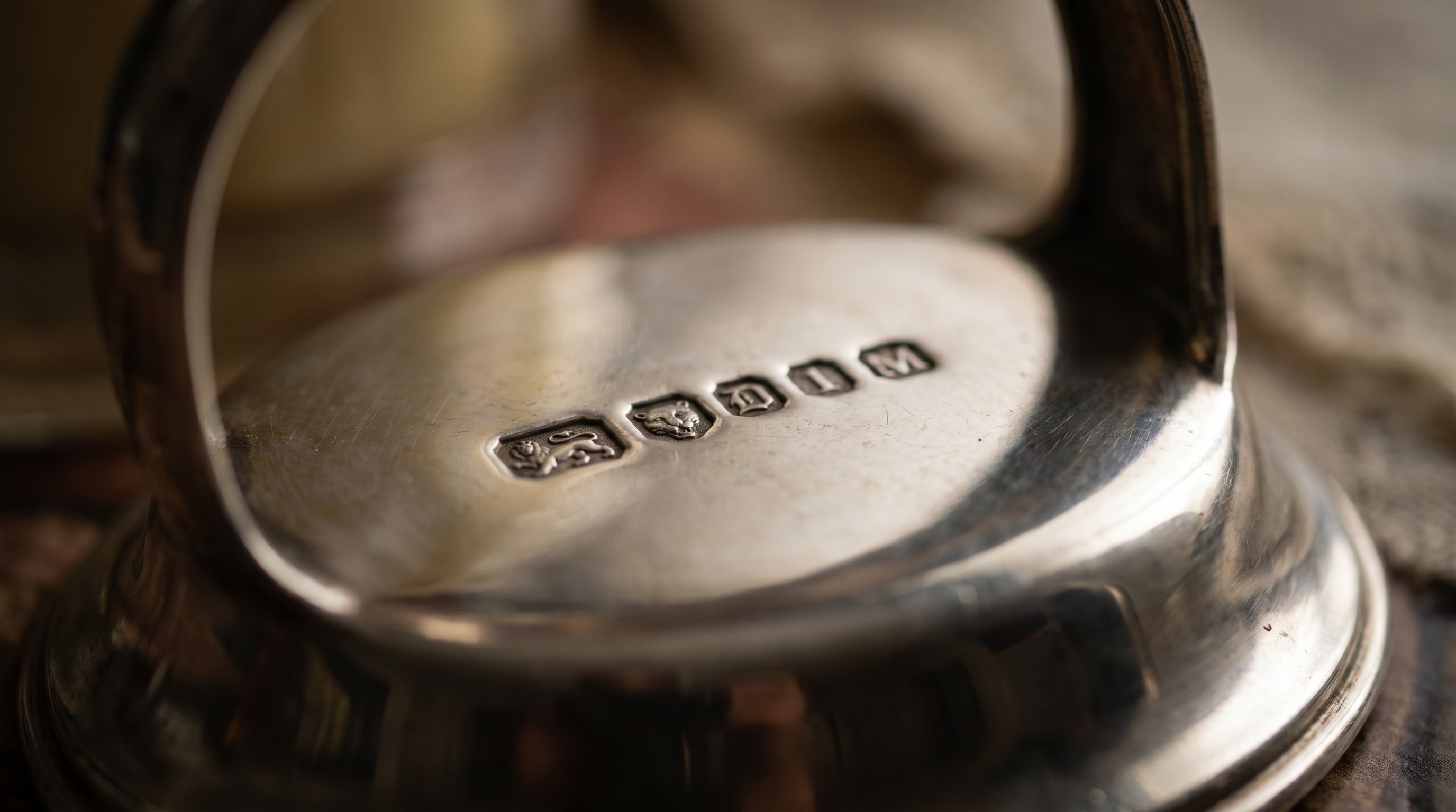British silver hallmarks on the base of an antique toast rack