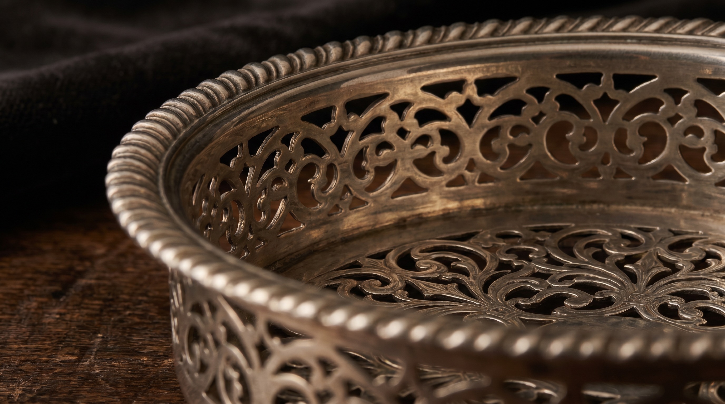 Pierced silver gallery of an antique wine coaster