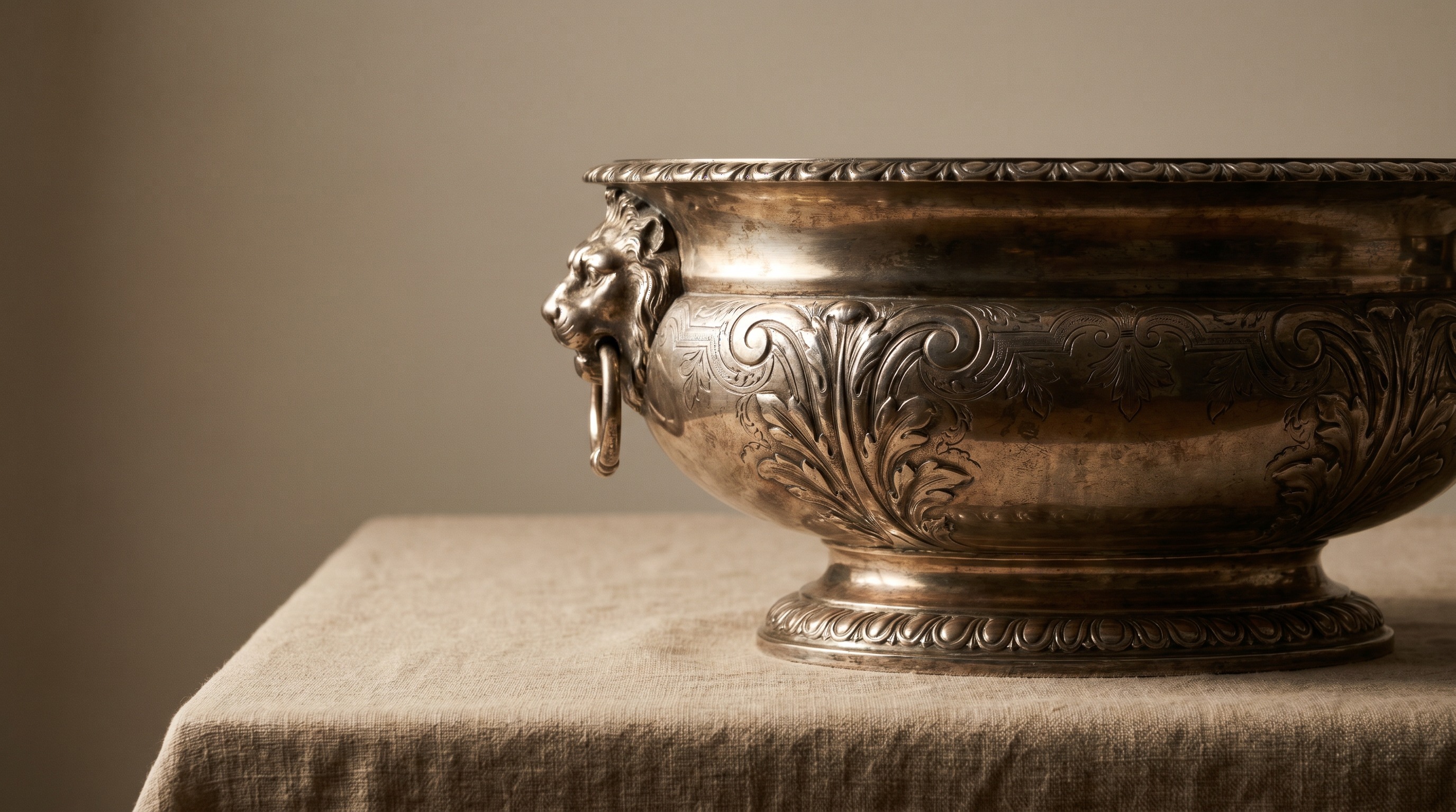 Grand antique Regency sterling silver wine cooler with lion mask handles