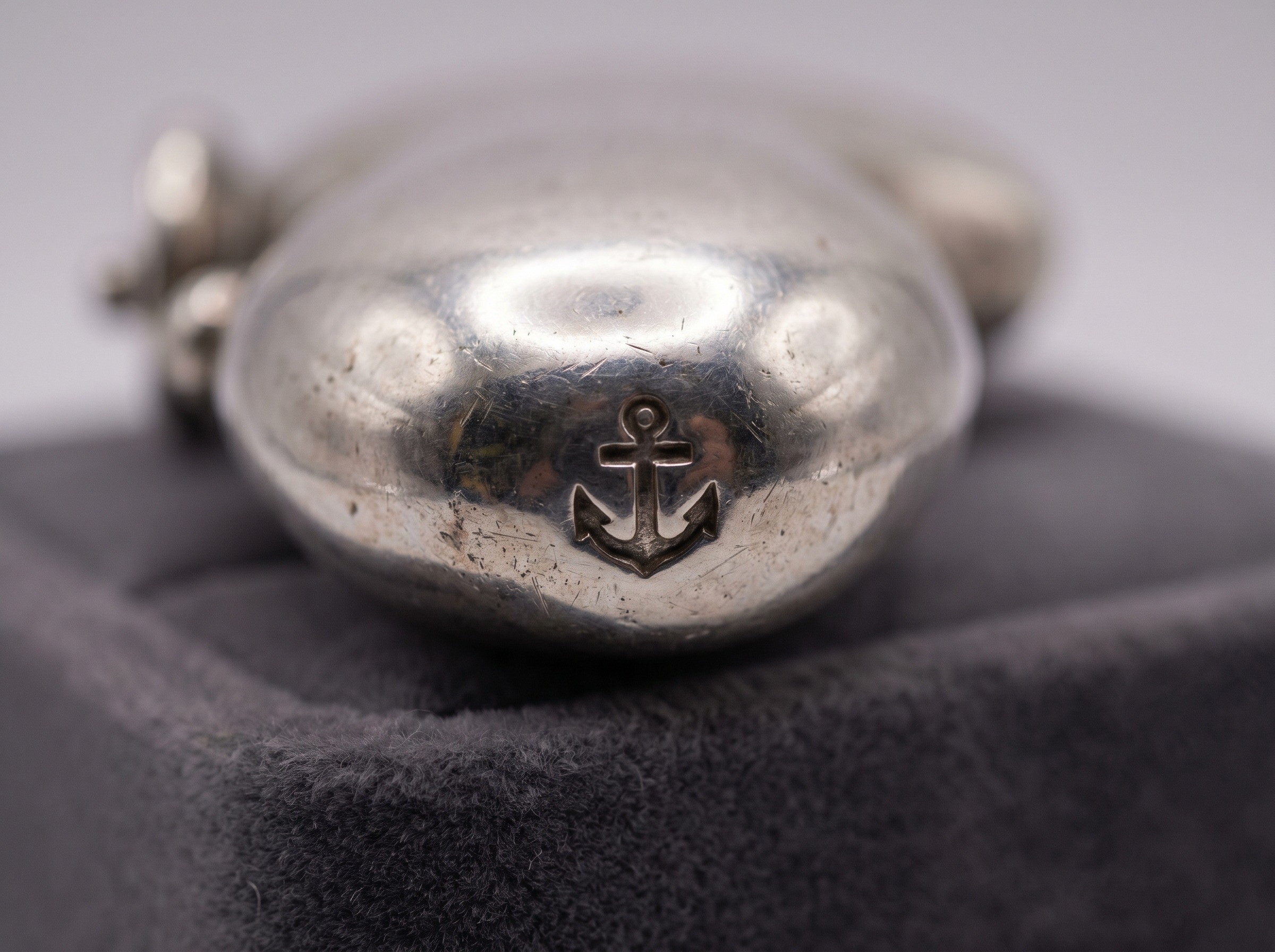 Extreme macro of Birmingham Assay Office anchor hallmark struck on sterling silver