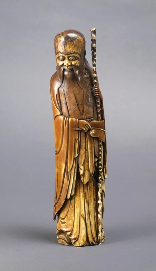 Shoulao, the god of long life, with his domed forehead and knotted staff: Chinese ivory figure, Ming dynasty, about 1580 to 1644. Photo: Cleveland Museum of Art, CC0