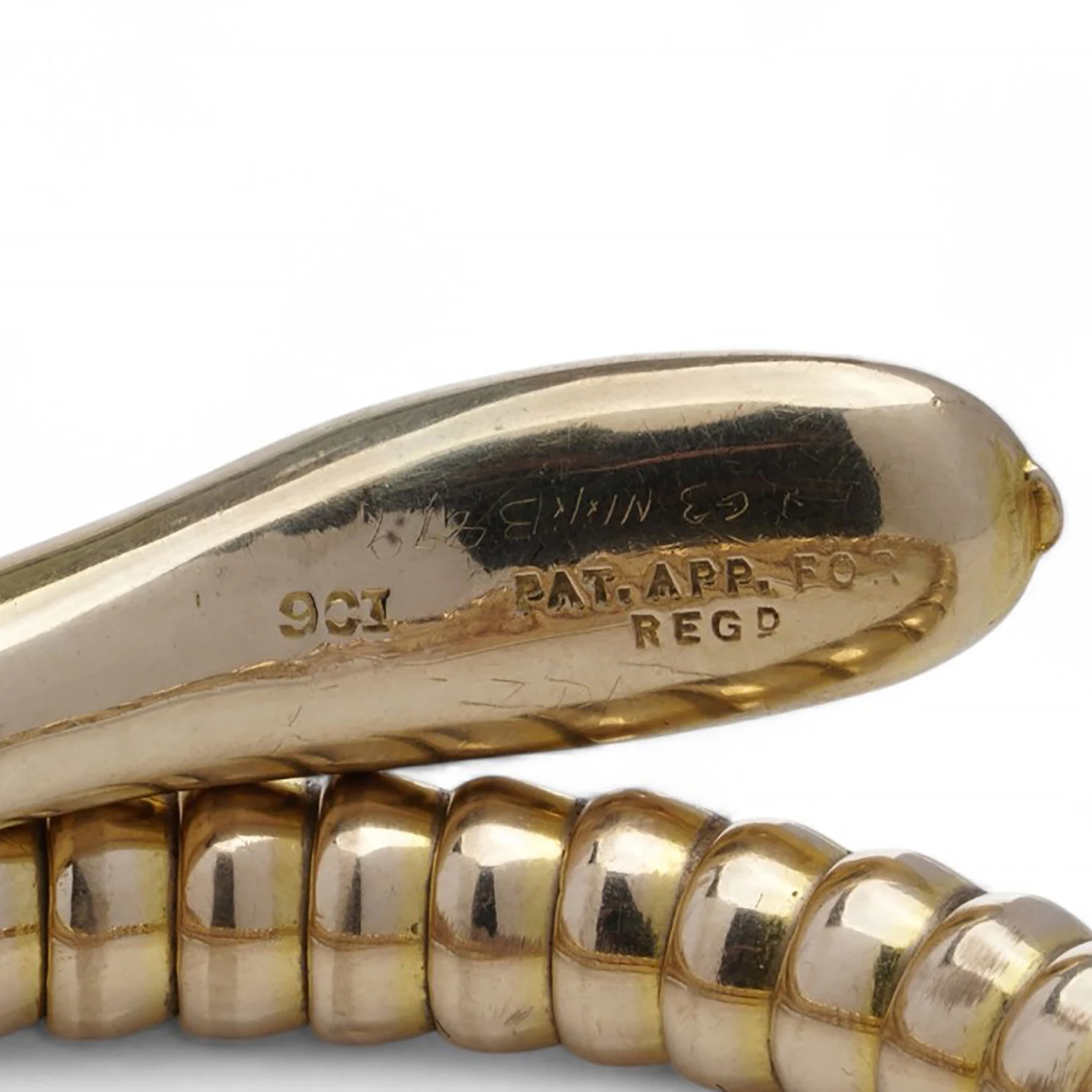 9CT and PAT. APP. FOR REGD stamped on the head of a vintage gold snake bracelet, from our collection