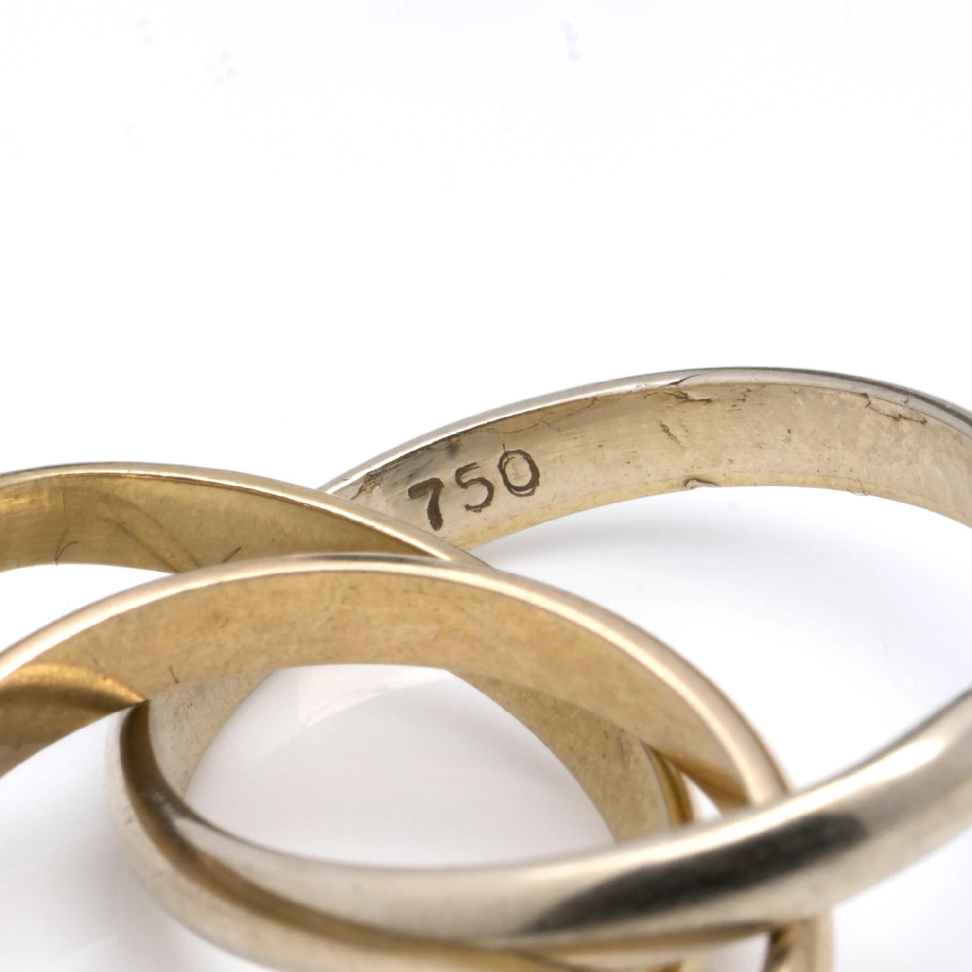 750 stamped inside a three-band rolling ring: 18KT gold, from our collection