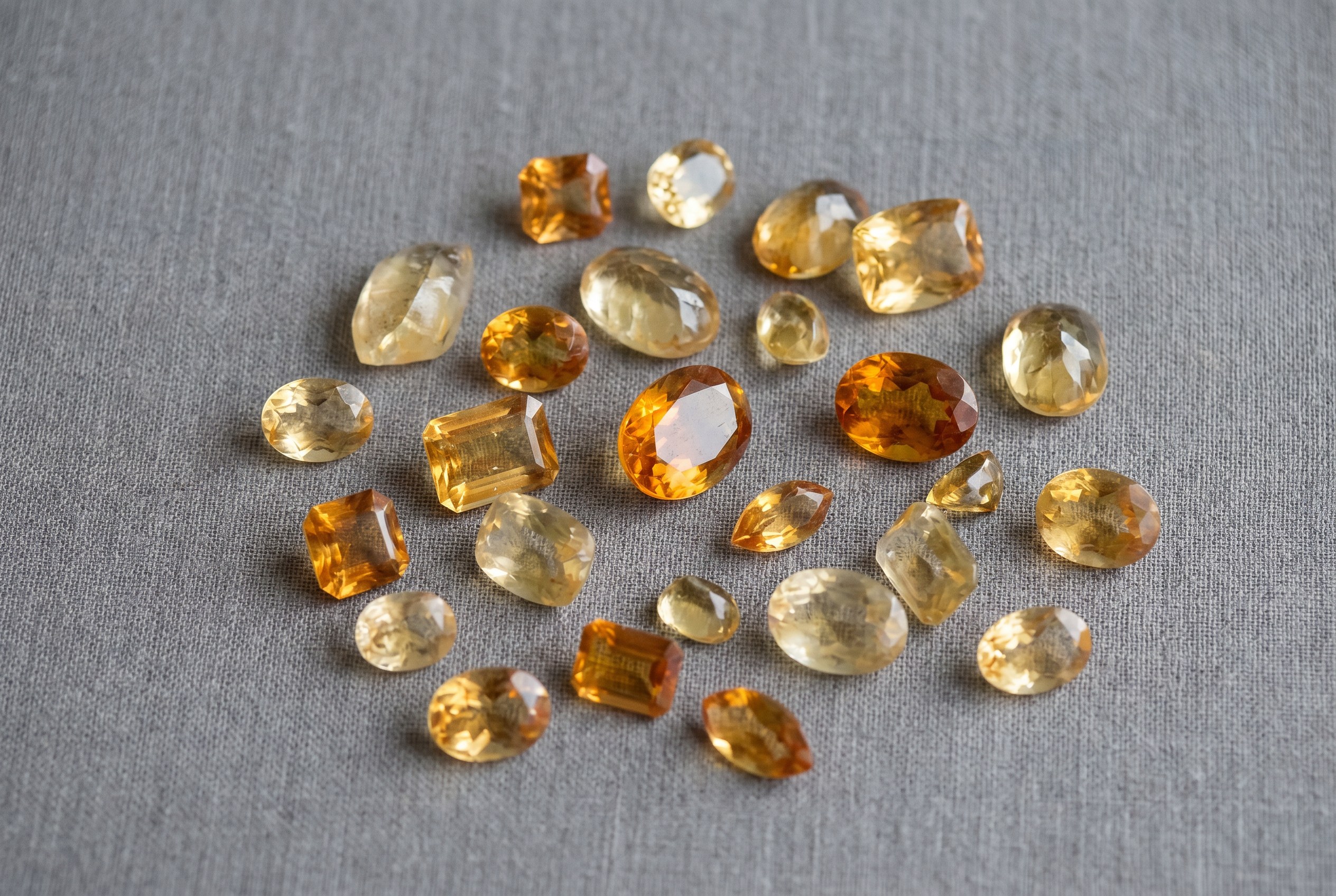 Loose citrine gemstones from pale lemon to madeira orange