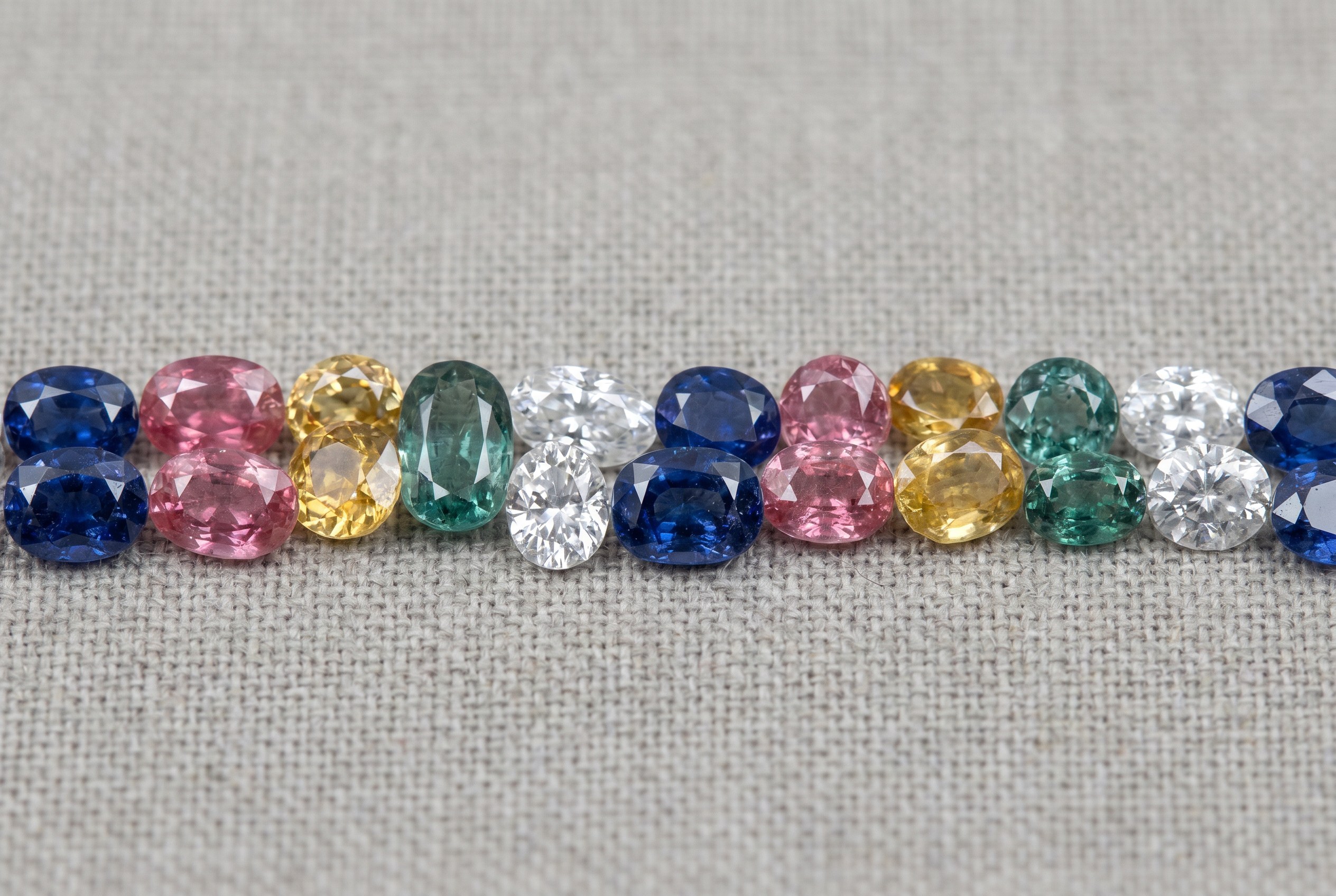 Loose sapphires in blue, pink, yellow, teal and white