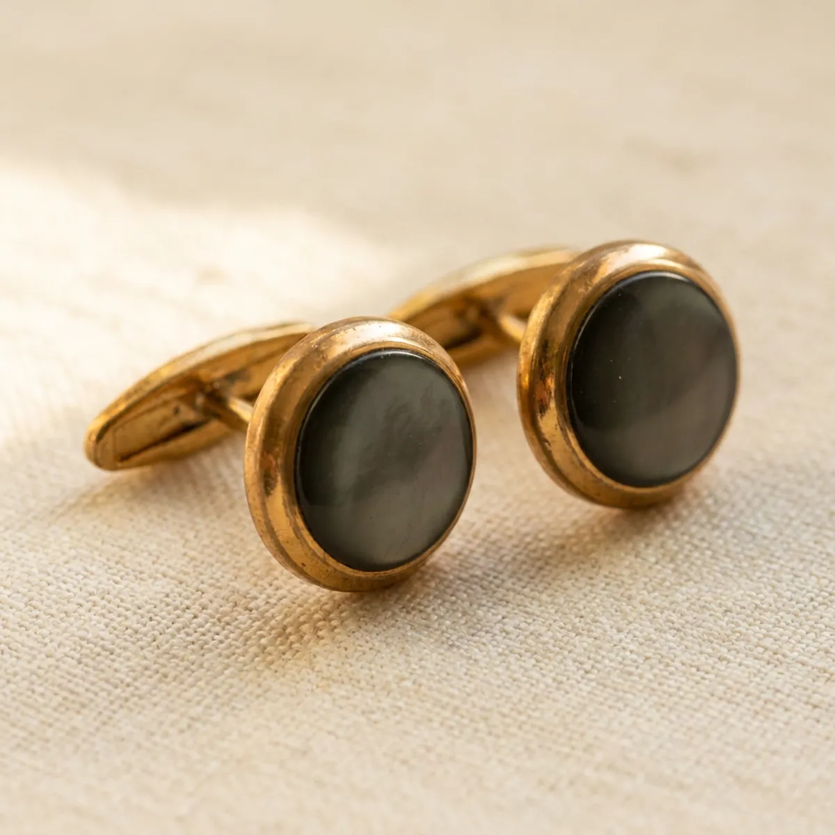 A pair of plain gold cufflinks