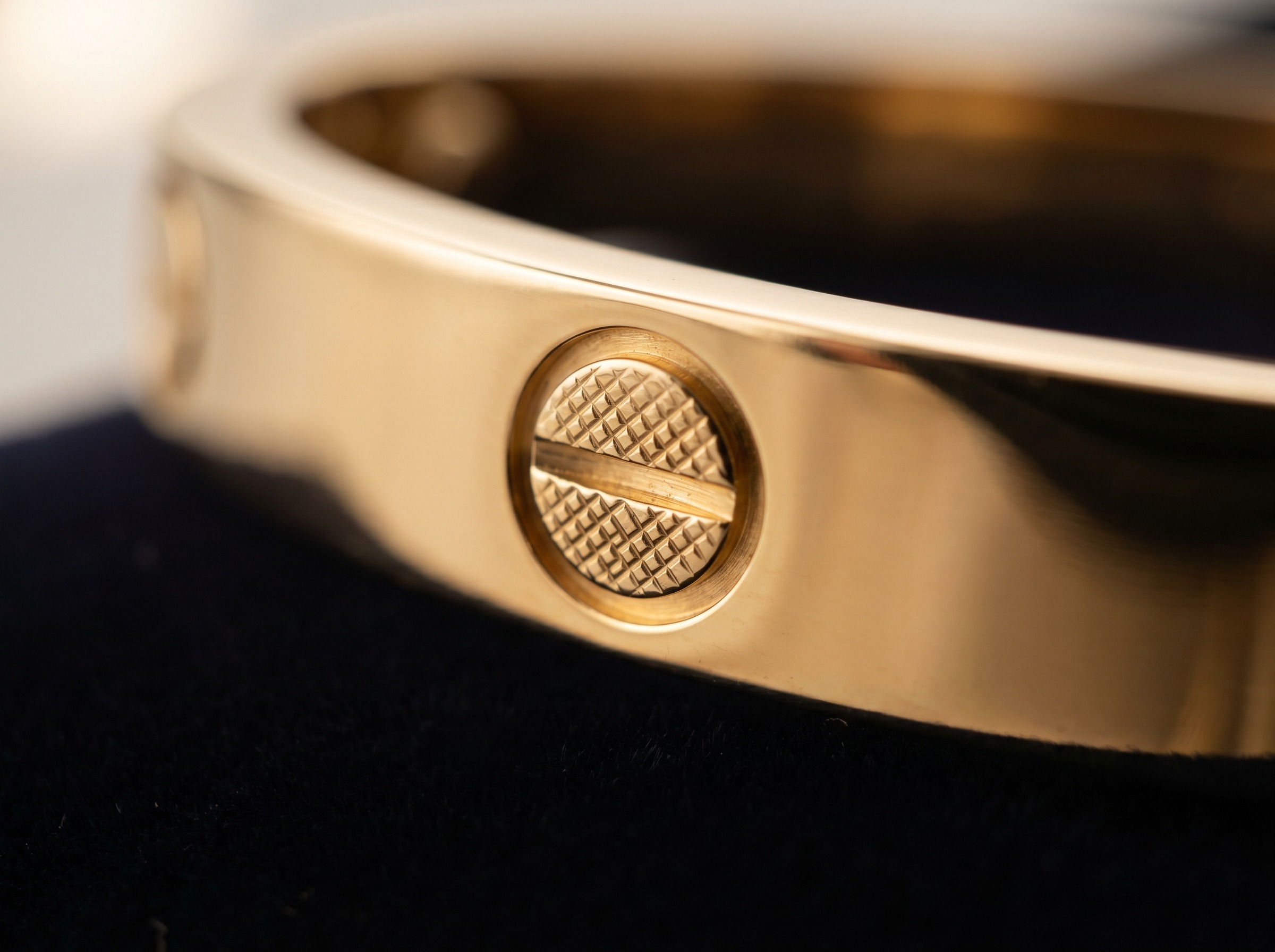 Close-up of the screw motif on a Cartier Love bracelet