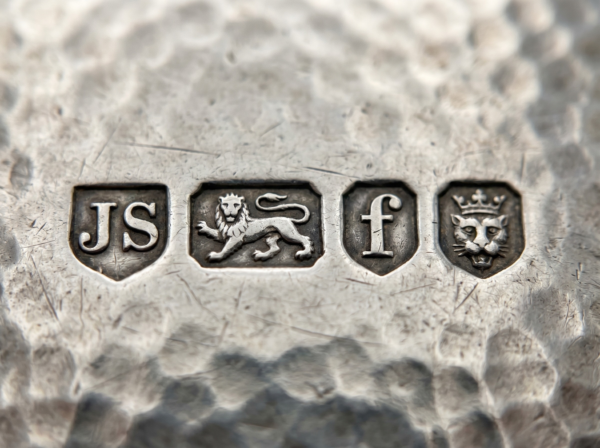 Guild of Handicraft maker's mark and London hallmark on hand-hammered Arts and Crafts sterling silver