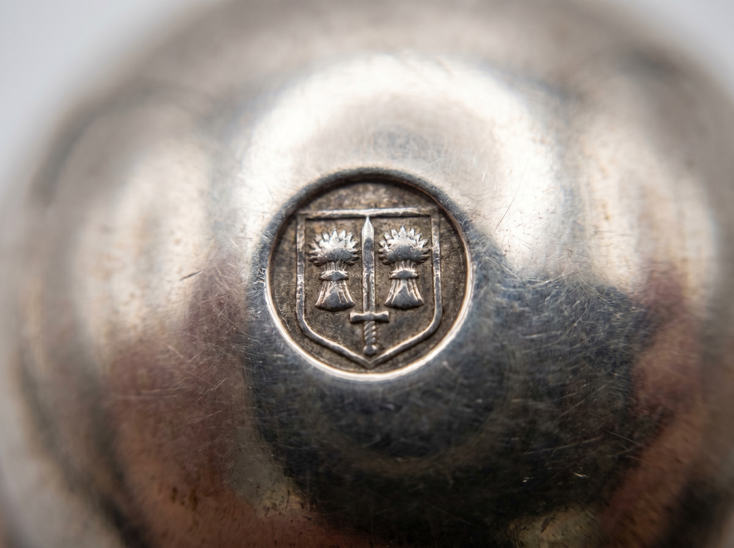 Extreme macro of Chester Assay Office wheatsheaves and sword hallmark struck on antique sterling silver