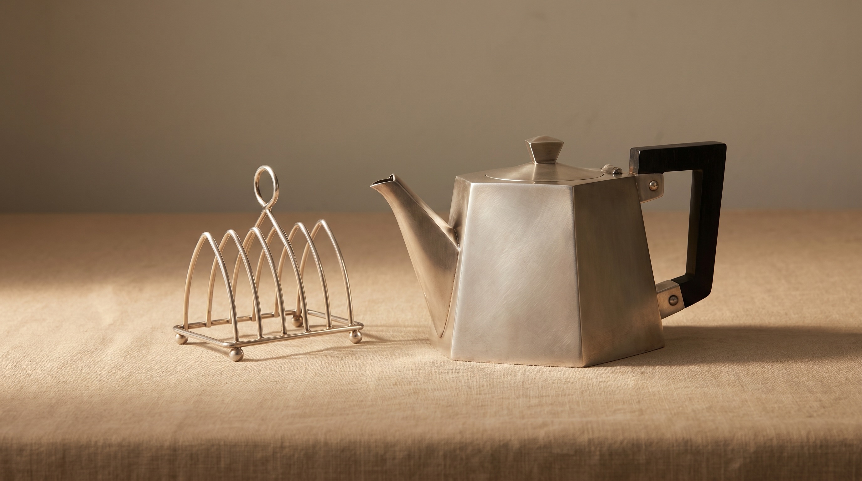 Radically minimal geometric Victorian silver-plated teapot and toast rack in the style of Christopher Dresser — Mozeris Fine Antiques guide