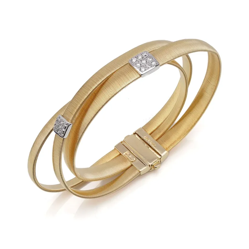 Our Marco Bicego 18KT gold coil bracelet with diamonds, bought by Mozeris Fine Antiques
