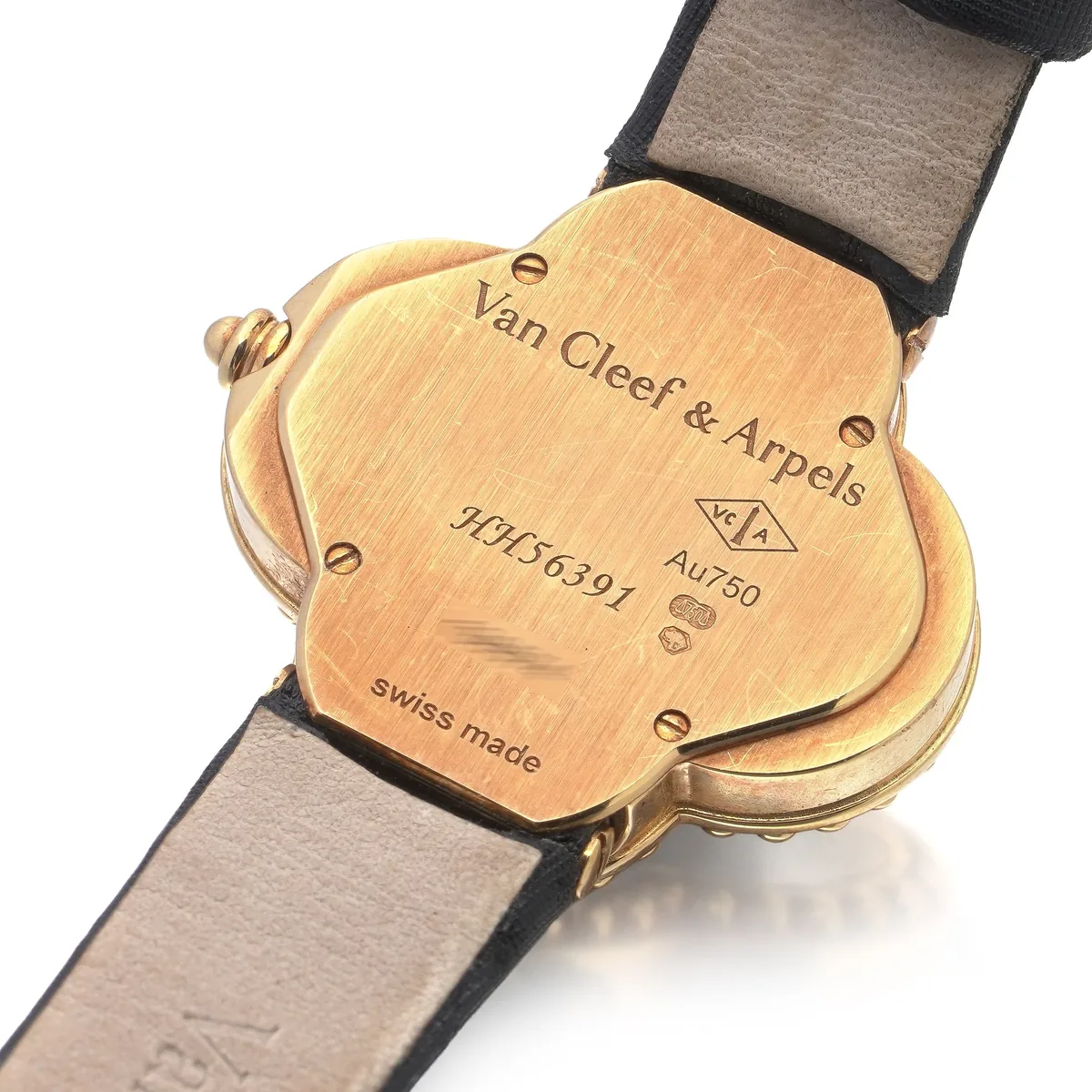 The back of our Van Cleef & Arpels Alhambra watch: signature, reference, Au750 and Swiss marks
