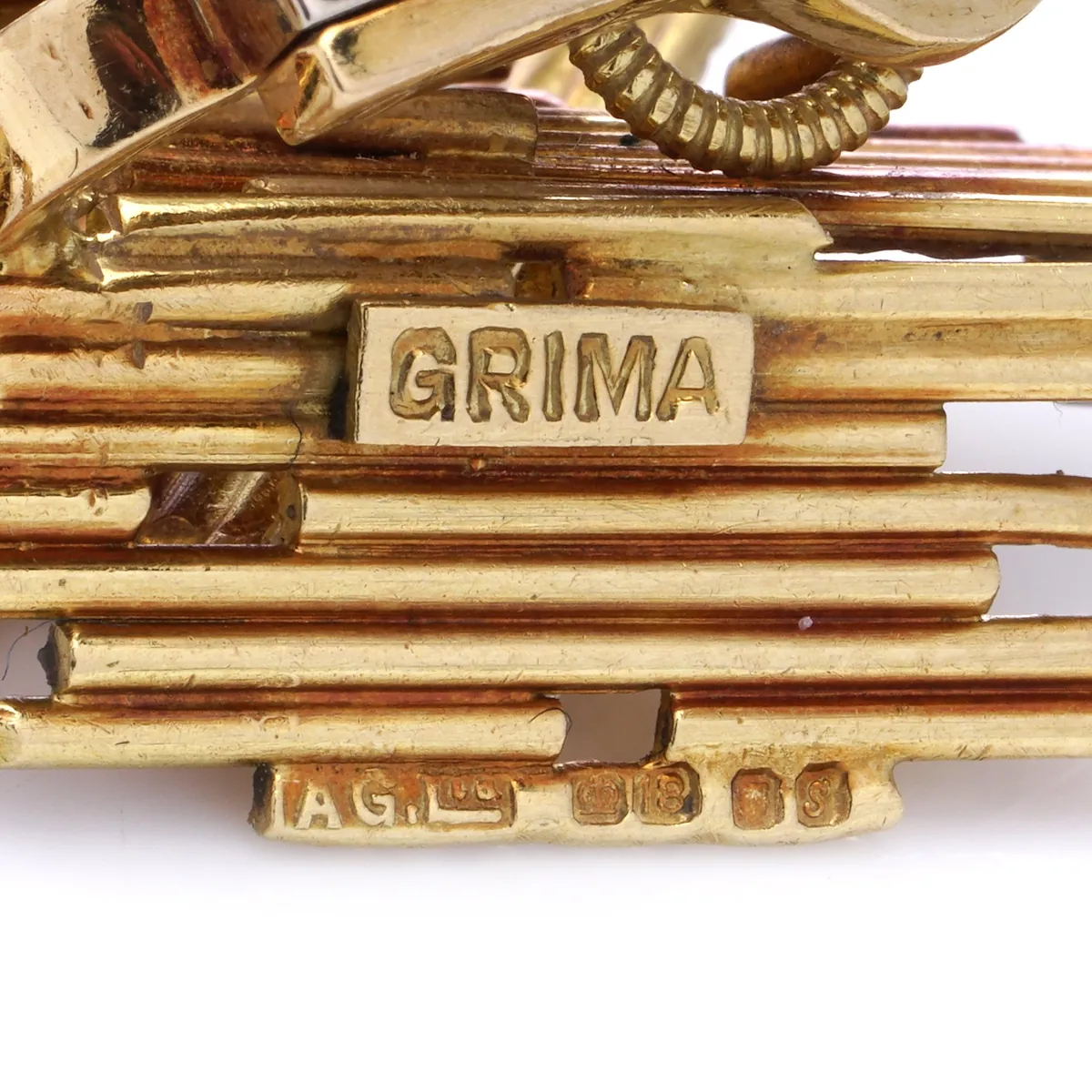 Grima signature and hallmarks on the back of textured gold earrings