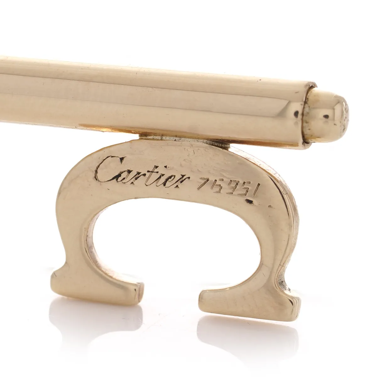 Cartier signature and 750 mark stamped on an 18KT gold Cartier key charm