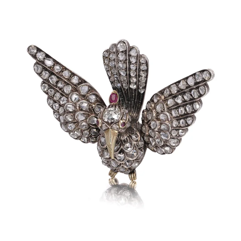Our Victorian gold and silver bird brooch with rose-cut diamonds and ruby eyes
