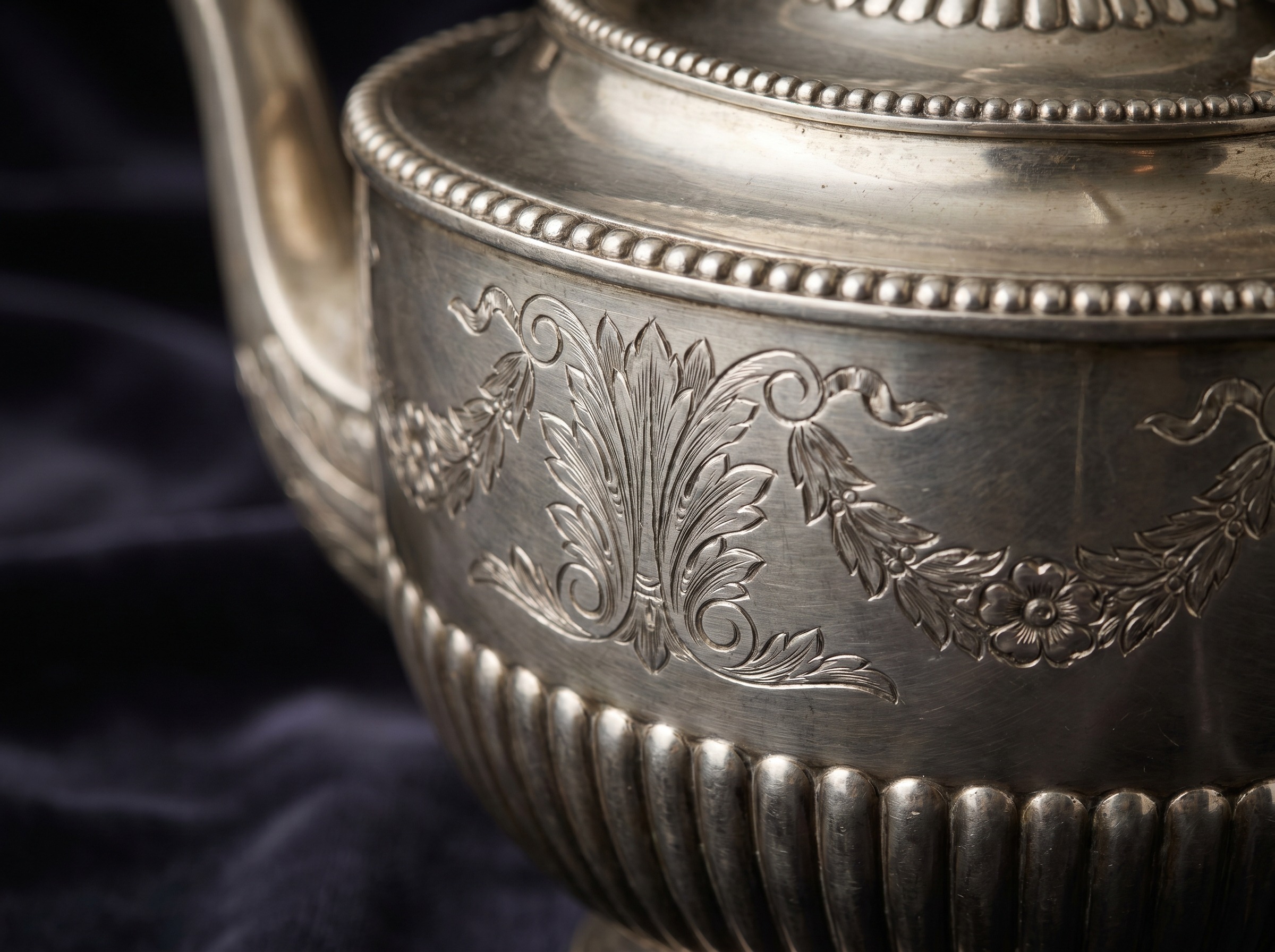 Extreme macro of bright-cut neoclassical engraving on antique Georgian sterling silver