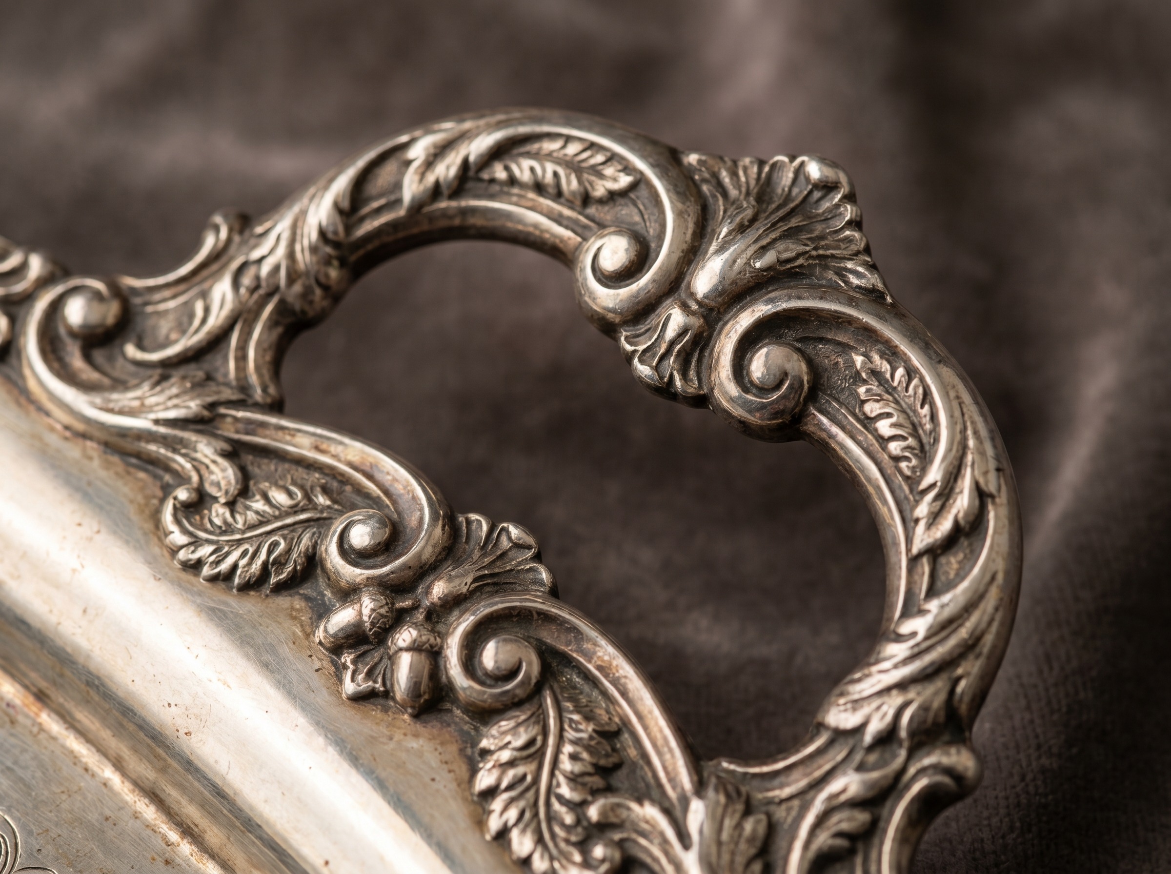 Crisp cast and electroformed ornament on Victorian Elkington silver plate — macro detail