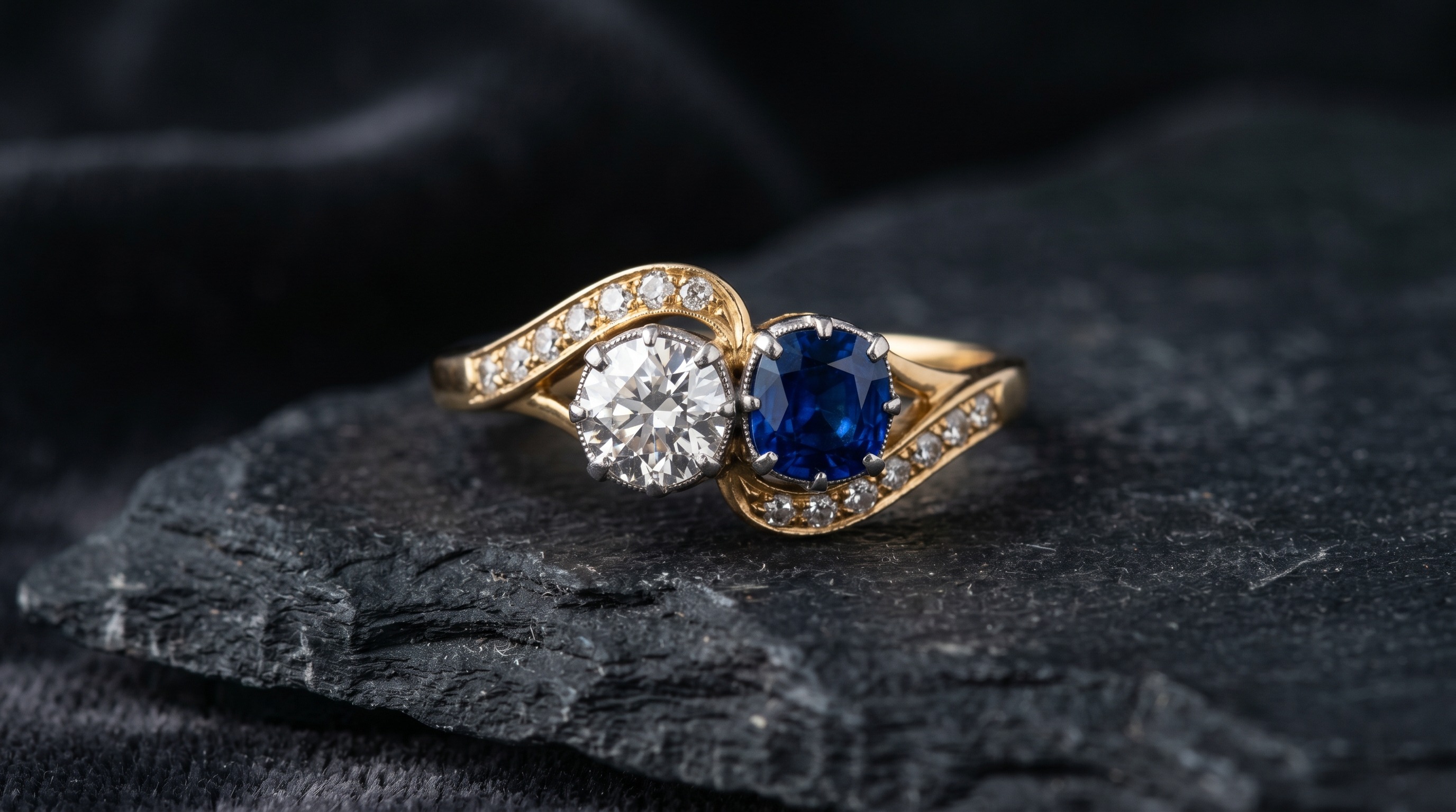 Antique toi et moi two-stone crossover engagement ring on a dark background