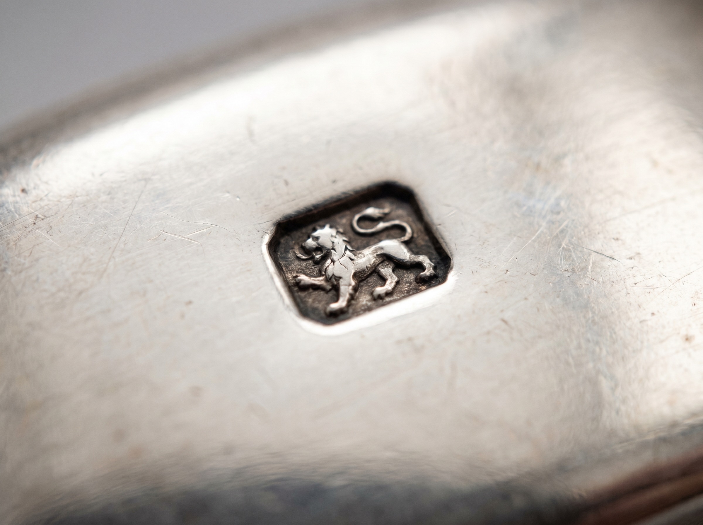 Extreme macro of Scottish lion rampant standard mark struck on antique Glasgow-assayed sterling silver