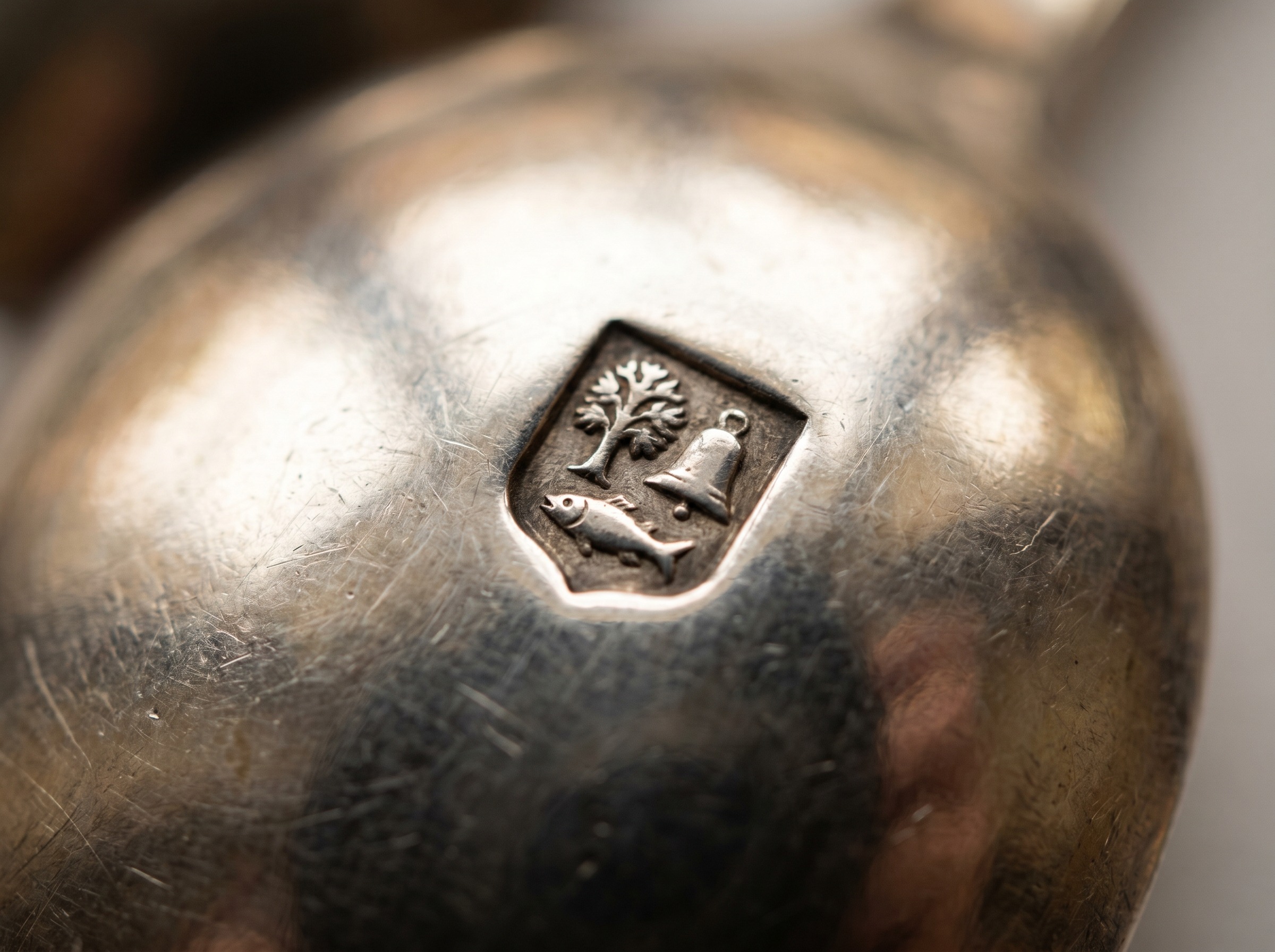 Extreme macro of Glasgow Assay Office tree, fish and bell hallmark struck on antique Scottish sterling silver