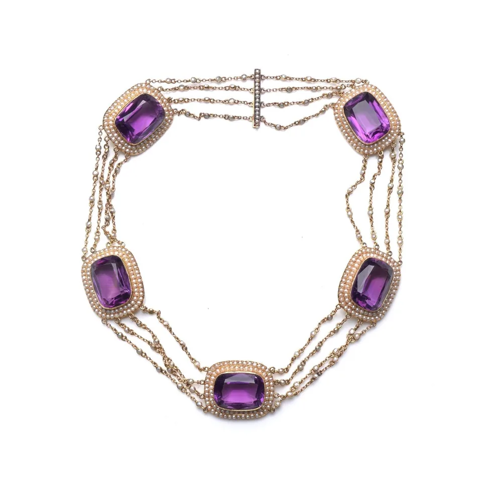 A Victorian necklace of five seed pearl strands joined by cushion-cut amethysts framed in seed pearls, 14KT gold