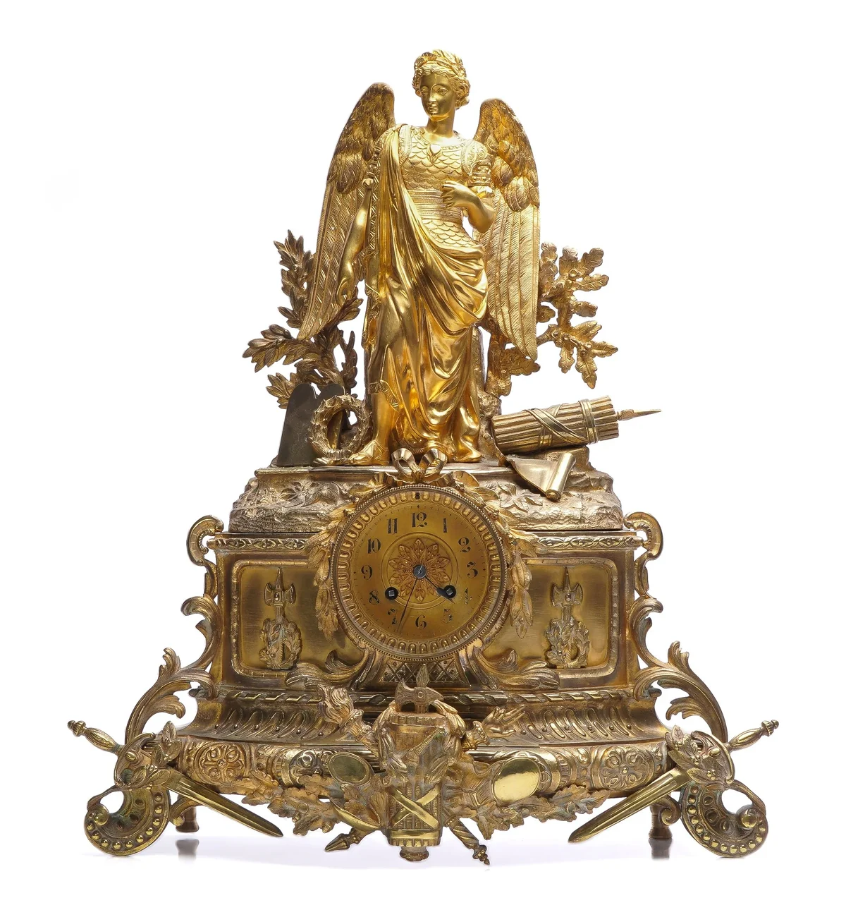 Antique 19th century French gilt bronze mantel clock with a winged allegorical figure standing above the dial on a scrolled base