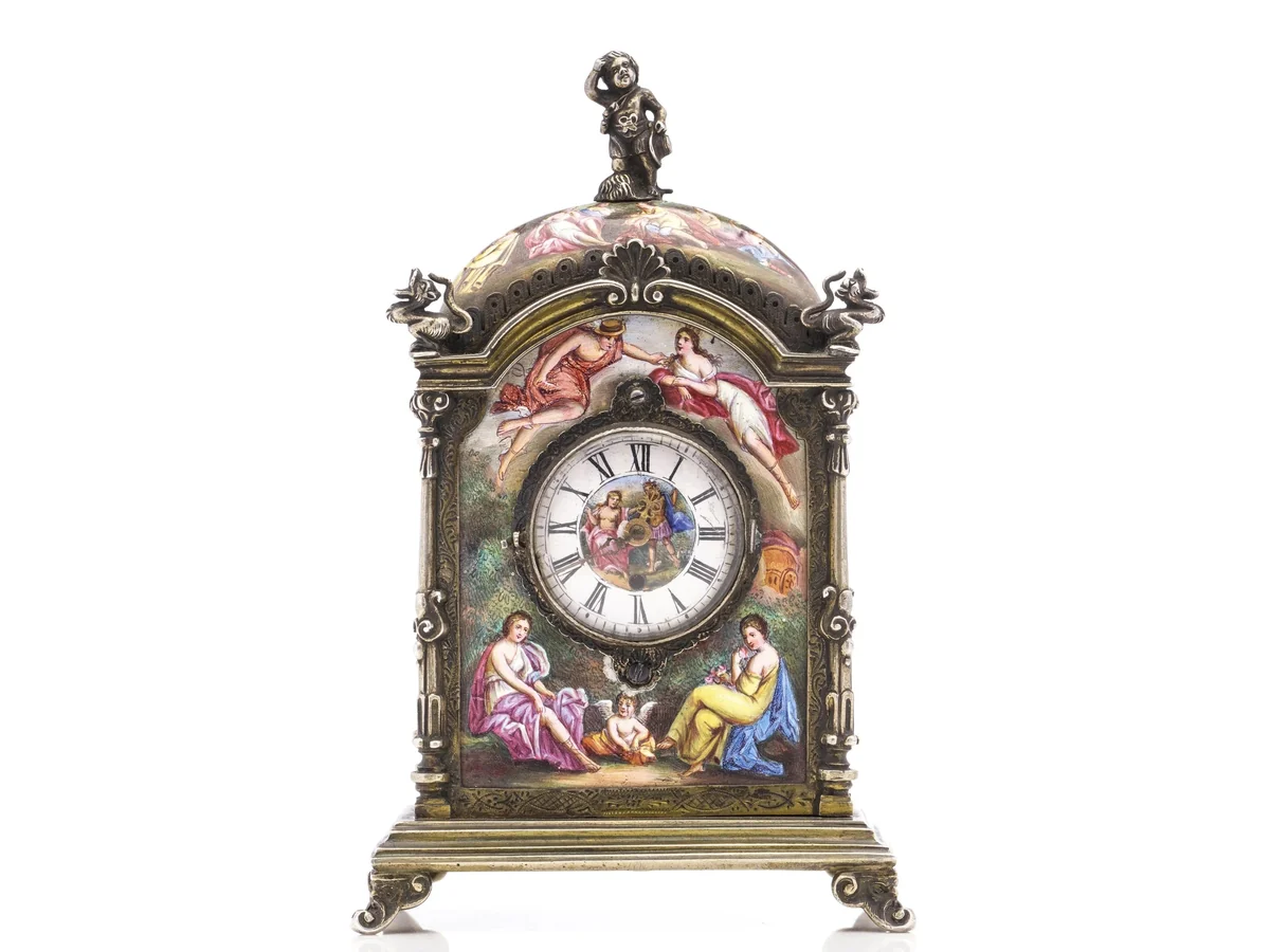 Viennese silver gilt and painted enamel table clock of about 1880 by Hermann Ratzersdorfer, with classical figure scenes on every panel