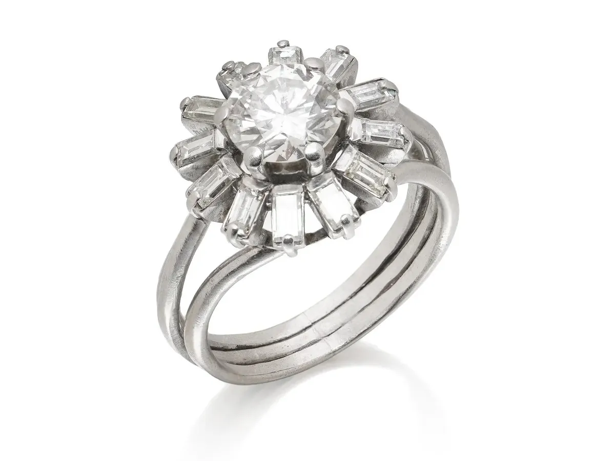 1950s platinum diamond cluster ring with radiating baguettes