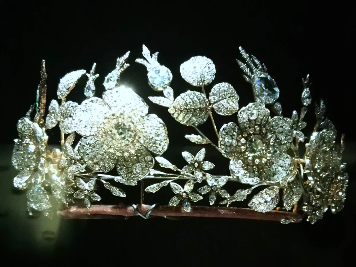 A diamond tiara of 1830 by Jean-Baptiste Fossin of Chaumet: large open brier roses and sprays of jasmine and leaves, all set with diamonds, rising from a slim band