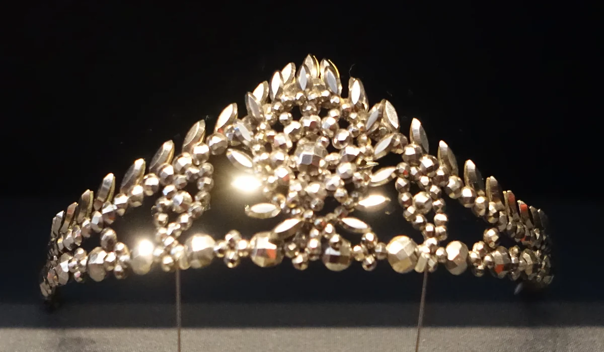 A cut steel tiara of the 1850s or 1860s: faceted steel studs and leaves riveted to a brass frame, made to sparkle like diamonds