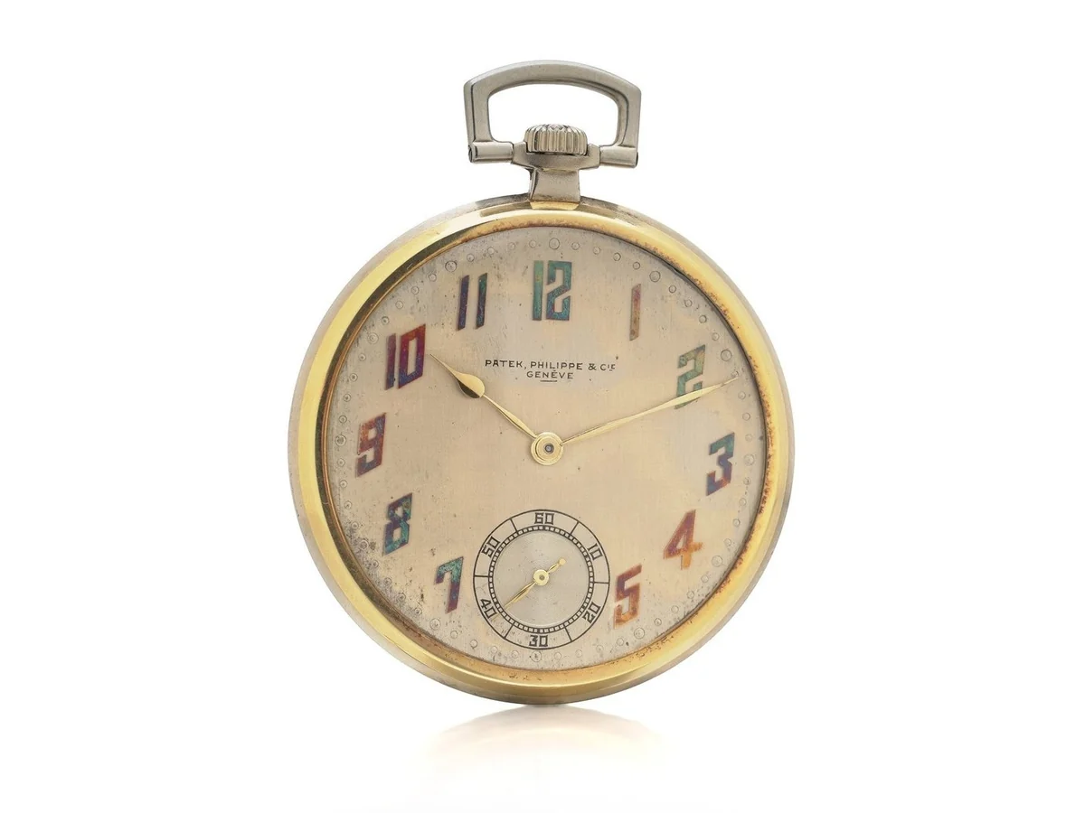 A 1925 Patek Philippe 18KT gold open face pocket watch with enamel Breguet numerals and a signed dial