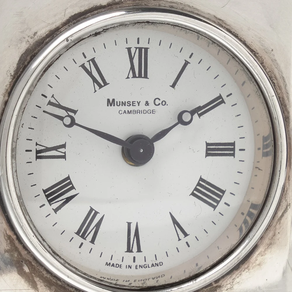 Carriage clock dial signed Munsey and Co, Cambridge, the retailer, and marked Made in England