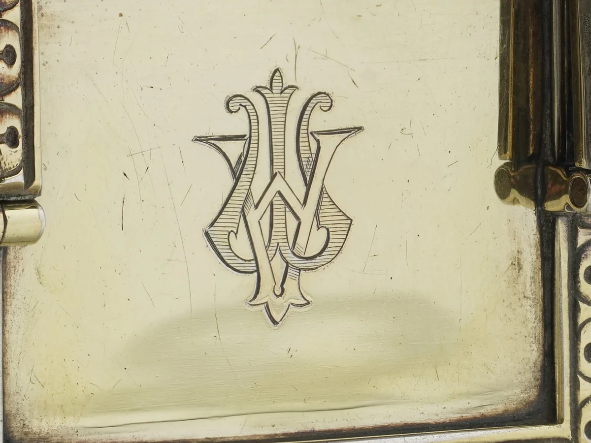 Engraved monogram on the hinged top of an Edwardian silver-gilt carriage clock