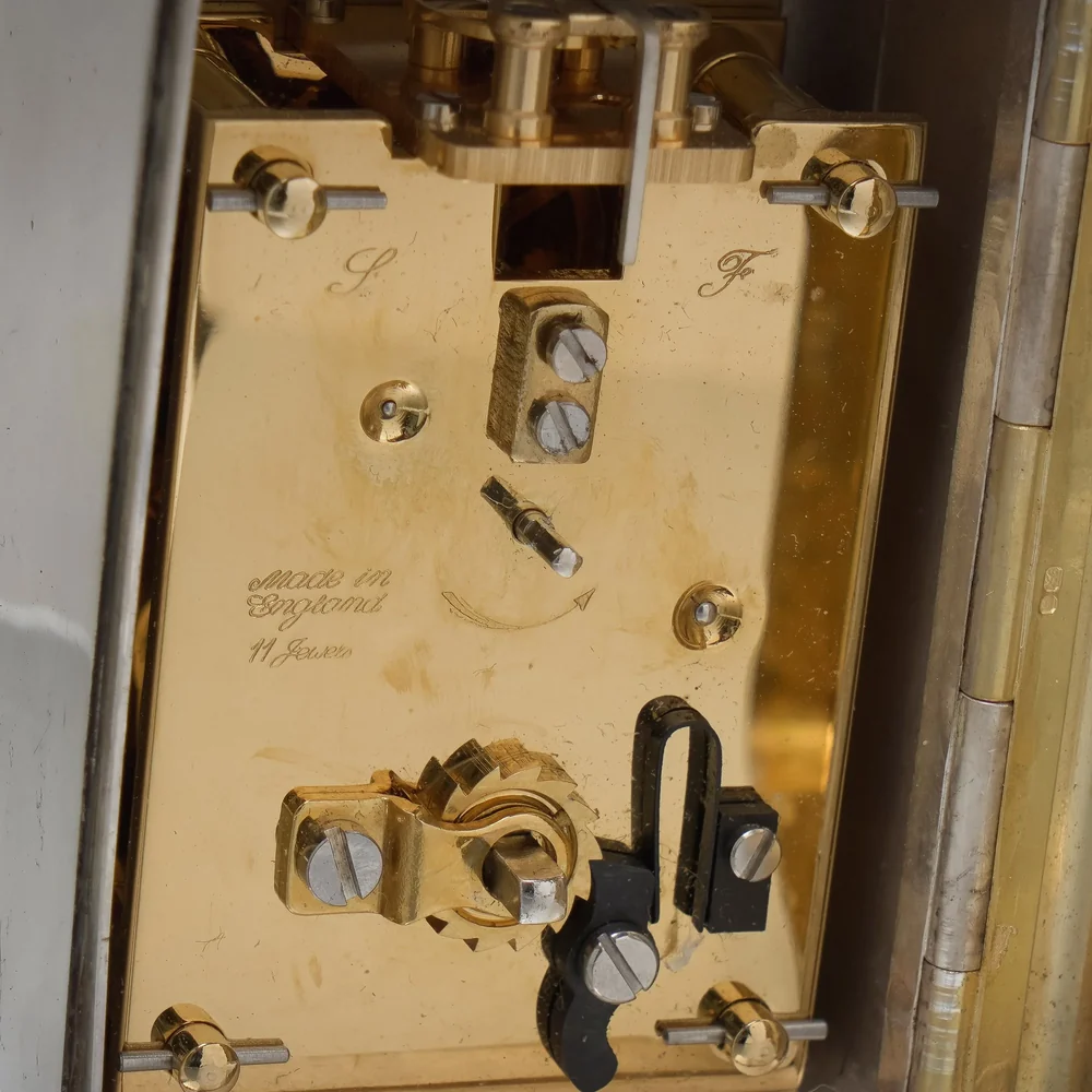 English carriage clock movement backplate engraved S and F for the regulator, Made in England and 11 Jewels